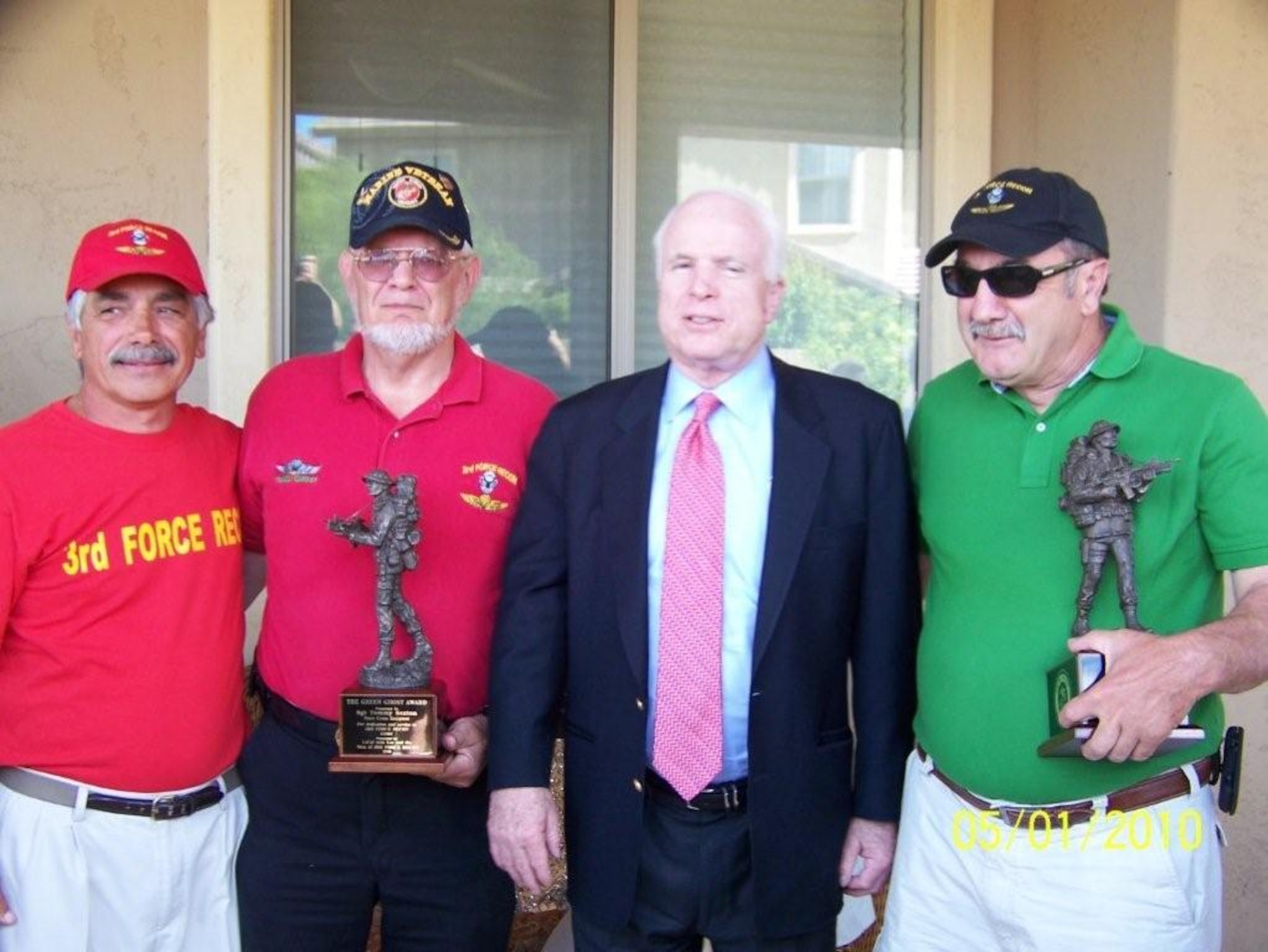 During the 3rd Force Reconnaissance Company, a U.S. Marine Corps special
operations unit, reunion in Surprise, Ariz., earlier this year, U.S. Senator
John McCain, R-Ariz., center, presents Thomas Sexton and Joseph Ventresca
with the Green Ghost award. The unit-specific award recognizes its members
for their valiant actions during Vietnam. (Courtesy photo)
