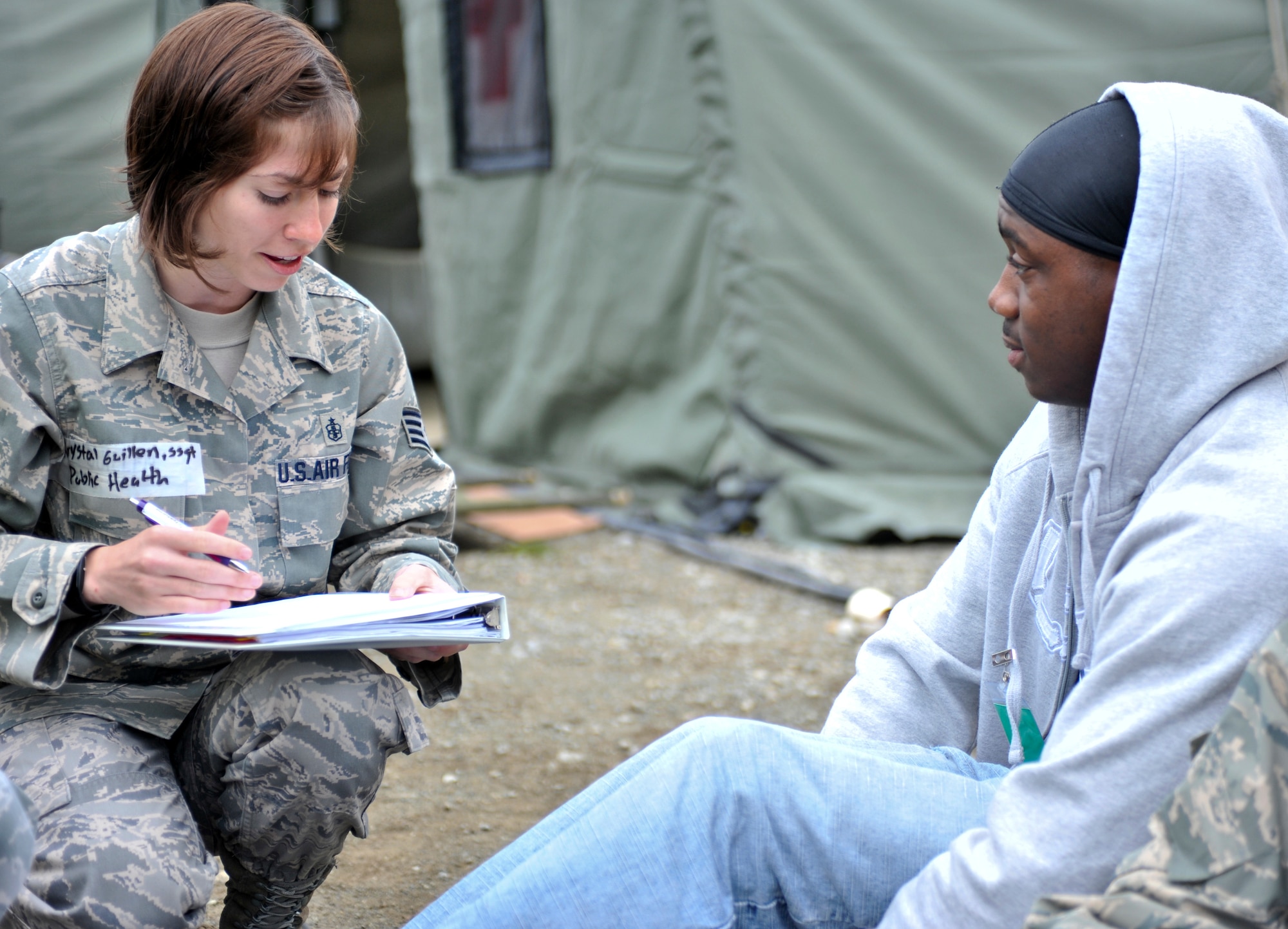 JOINT BASE ELMENDORF-RICHARDSON, Alaska – Staff Sgt. Krystal Guillen, 673d Medical Group, takes down information from a “patient”, Aug. 12. The five-day Expeditionary Medical Support Training was held for the first time at Joint Base Elmendorf-Richardson from Aug. 9-13. Eighty-one Airmen from around the Pacific Air Forces came to the mandatory pre-deployment training. The EMEDs training is typically held at Brooks City Base in San Antonio. (Air Force photo by Airman 1st Class Christopher Gross)