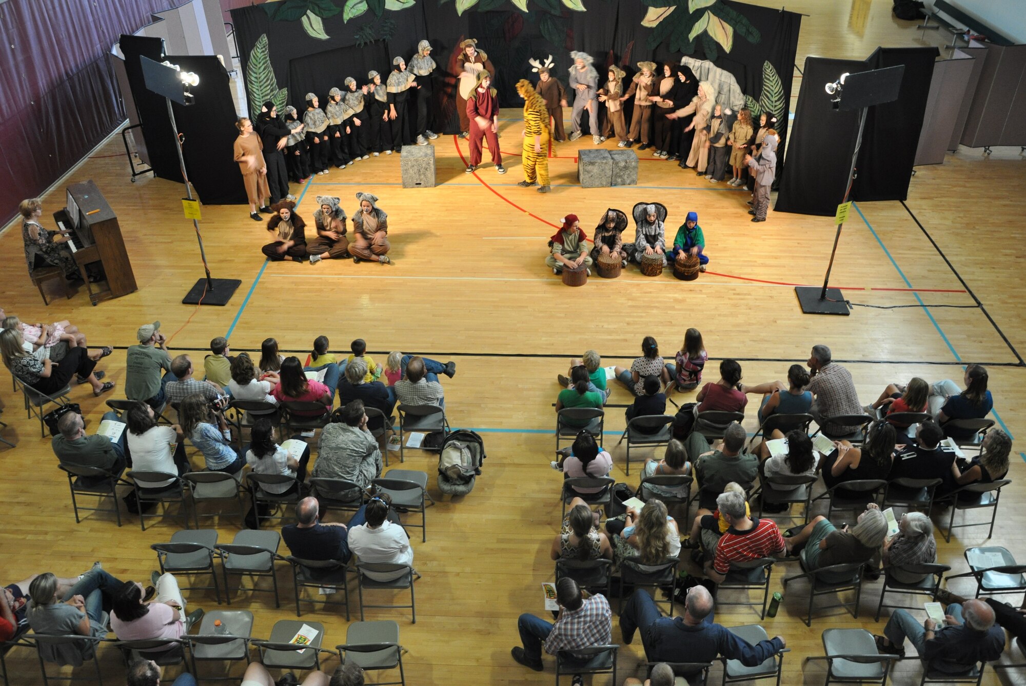 LAUGHLIN AIR FORCE BASE, Texas -- A group of Laughlin’s youth joins the Missoula Children’s Theatre group in a production of The Jungle Book at the Losano Fitness Center here August 13. The traveling theatre group visits numerous locations across the country and auditions local young people to join them in their productions. (U.S. Air Force photo by Airman 1st Class Blake Mize)
