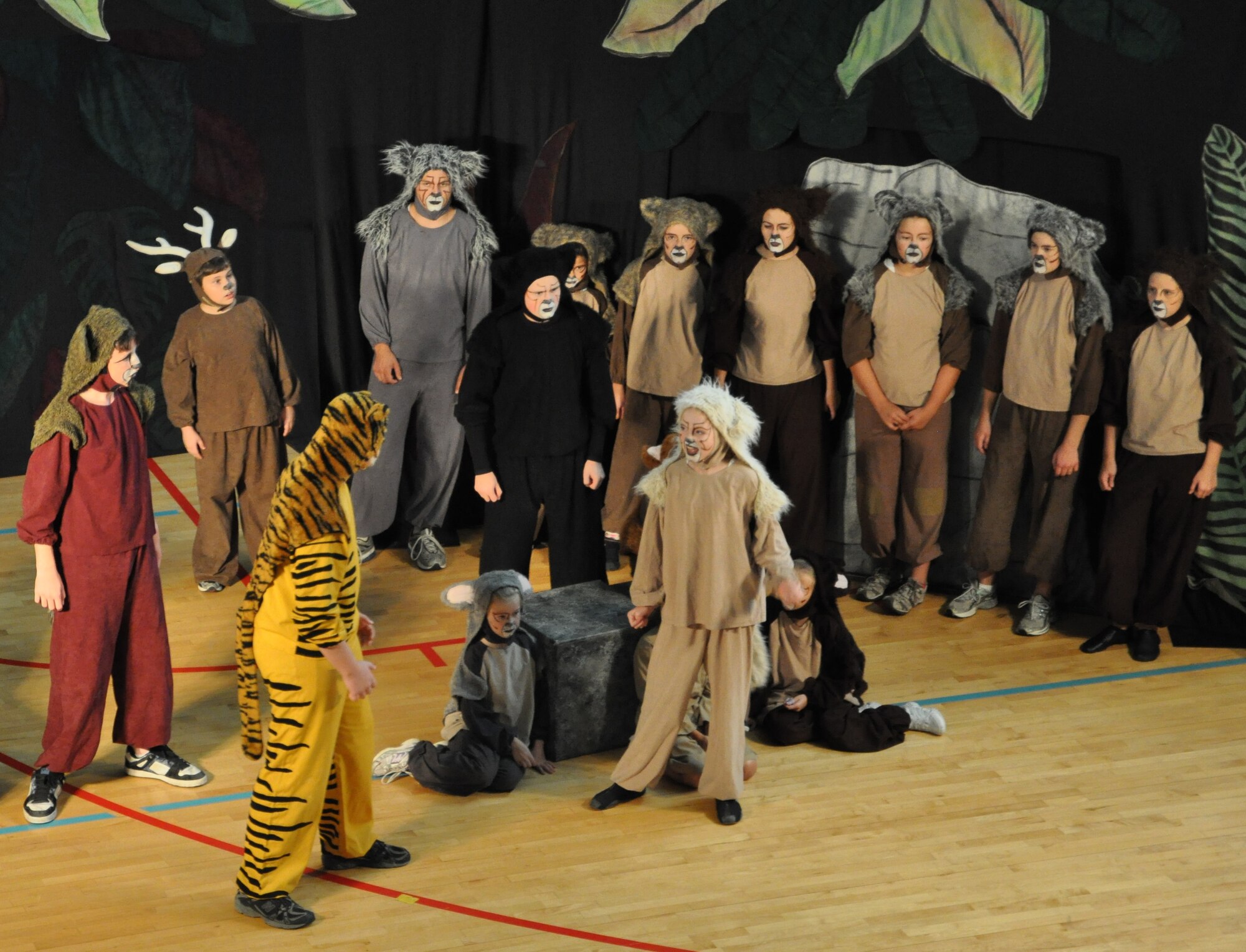 LAUGHLIN AIR FORCE BASE, Texas -- A group of Laughlin’s youth joins the Missoula Children’s Theatre group in a production of The Jungle Book at the Losano Fitness Center here August 13. The traveling theatre group visits numerous locations across the country and auditions local young people to join them in their productions. (U.S. Air Force photo by Airman 1st Class Blake Mize)