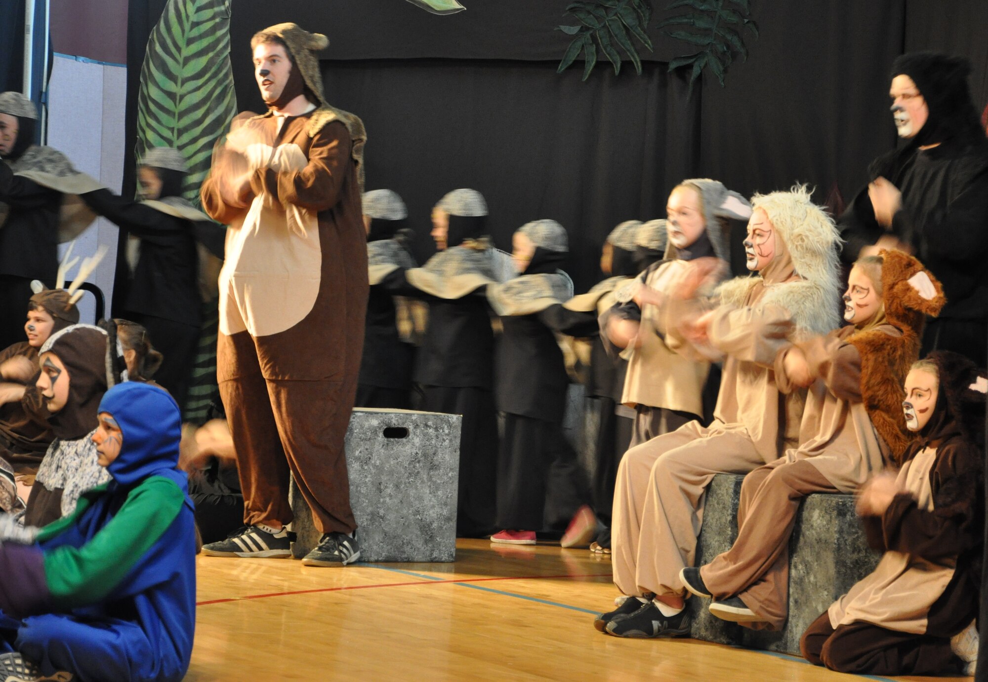 LAUGHLIN AIR FORCE BASE, Texas -- A group of Laughlin’s youth joins the Missoula Children’s Theatre group in a production of The Jungle Book at the Losano Fitness Center here August 13. The traveling theatre group visits numerous locations across the country and auditions local young people to join them in their productions. (U.S. Air Force photo by Airman 1st Class Blake Mize)