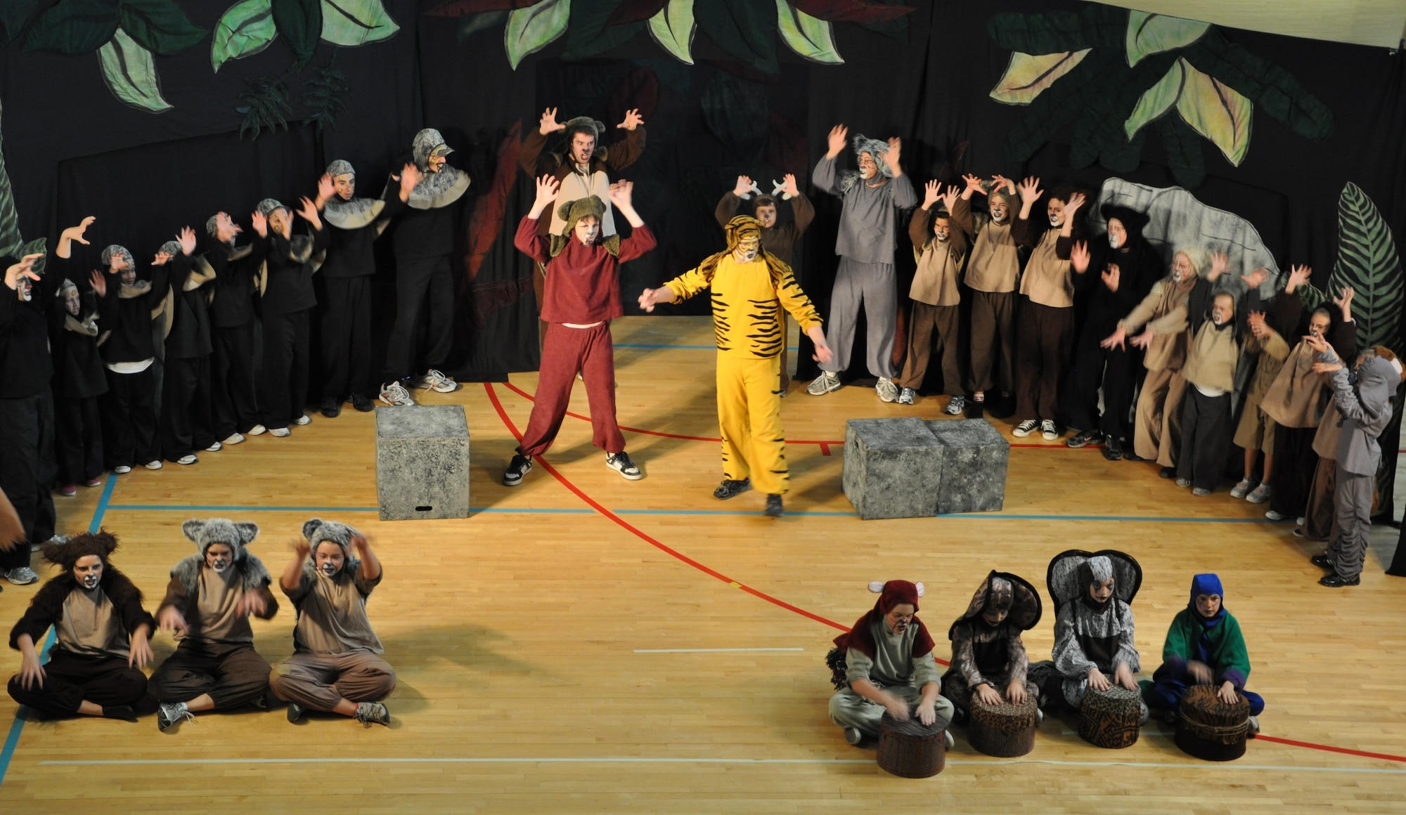 LAUGHLIN AIR FORCE BASE, Texas -- A group of Laughlin’s youth joins the Missoula Children’s Theatre group in a production of The Jungle Book at the Losano Fitness Center here August 13. The traveling theatre group visits numerous locations across the country and auditions local young people to join them in their productions. (U.S. Air Force photo by Airman 1st Class Blake Mize)