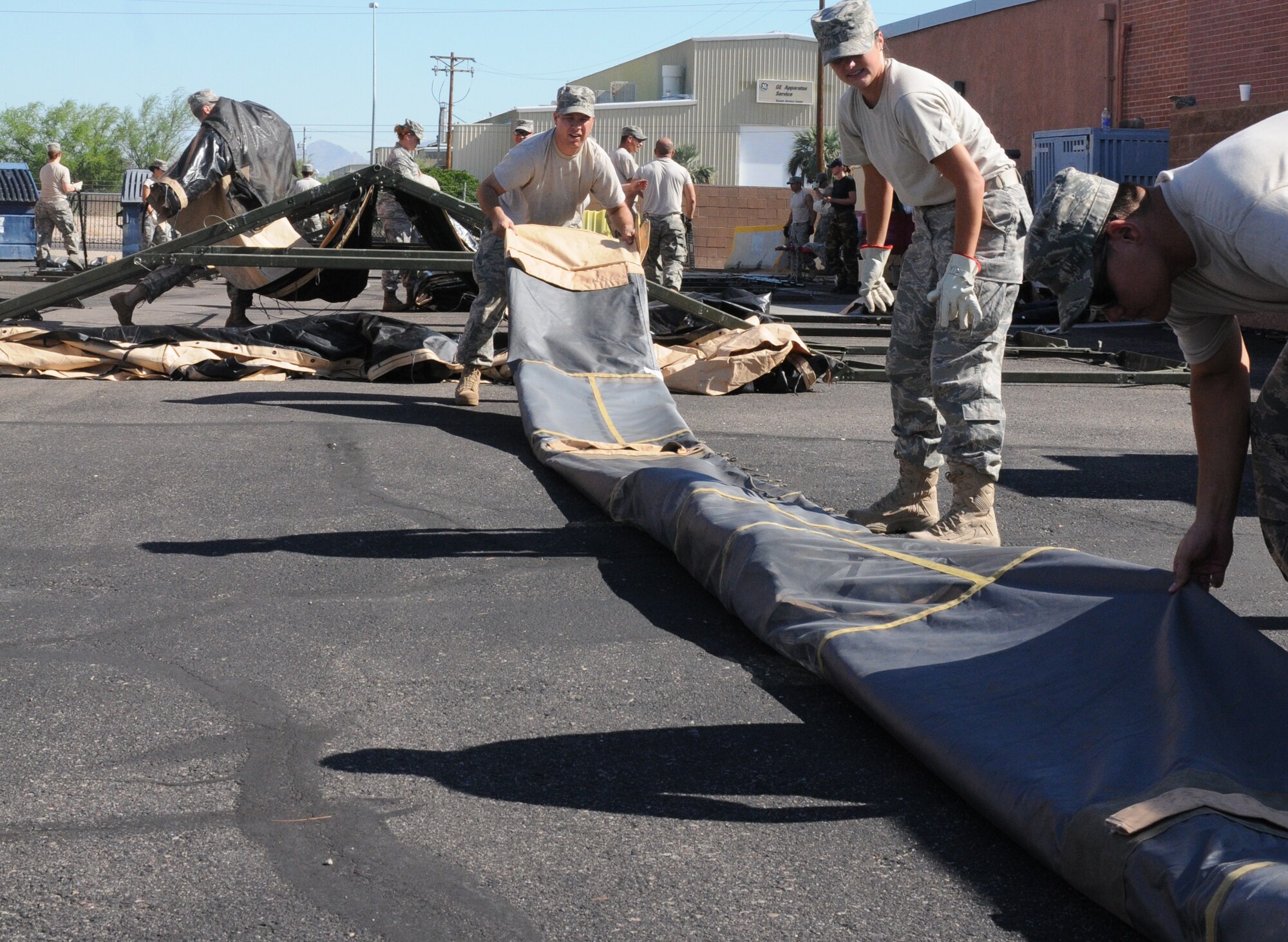 Members of the 162nd Force Support Squadron practice setting up and tearing down small shelter systems and temper tents here Aug. 11 and 13 as part of a week-long event known as home station training. The tents and shelters are used overseas for a variety of purposes when permanent structures are not available. (Air Force photo by Staff Sgt. Jordan Jones)