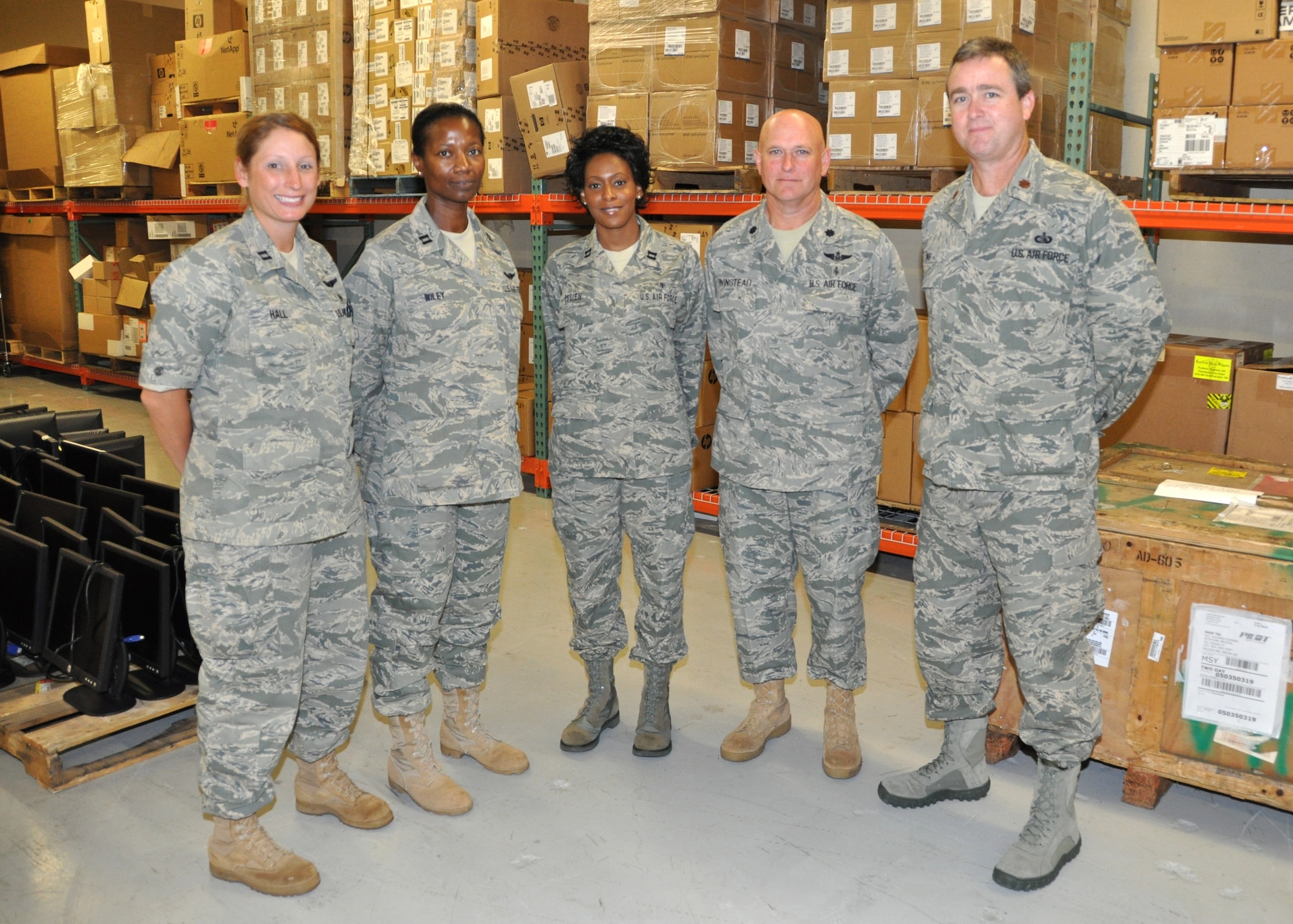 Several Medical Service Corps officers from the Mississippi Air National Guard’s 183rd Aeromedical Evacuation Squadron at Jackson visited their 81st Medical Group counterparts Aug. 5.   Shown in the 81st Medical Support Squadron medical materiel warehouse are, from left, Capts. Denise Hall and Julia Wiley, 183rd AES; Capt. Carmella Essien, 81st MDSS medical materiel director; Lt. Col. Rodney Winstead and Maj. Todd King, 183rd AES.  Not pictured was Col. Peter Mercier, 183rd AES commander.  The visitors participated in joint training provided by 81st MDG MSCs as part of a training affiliation agreement.   Cols. David Garrison, 81st MDG deputy commander, and Robert Cothron, 81st MDG administrator, were their hosts.  (U.S. Air Force photo by Kemberly Groue)