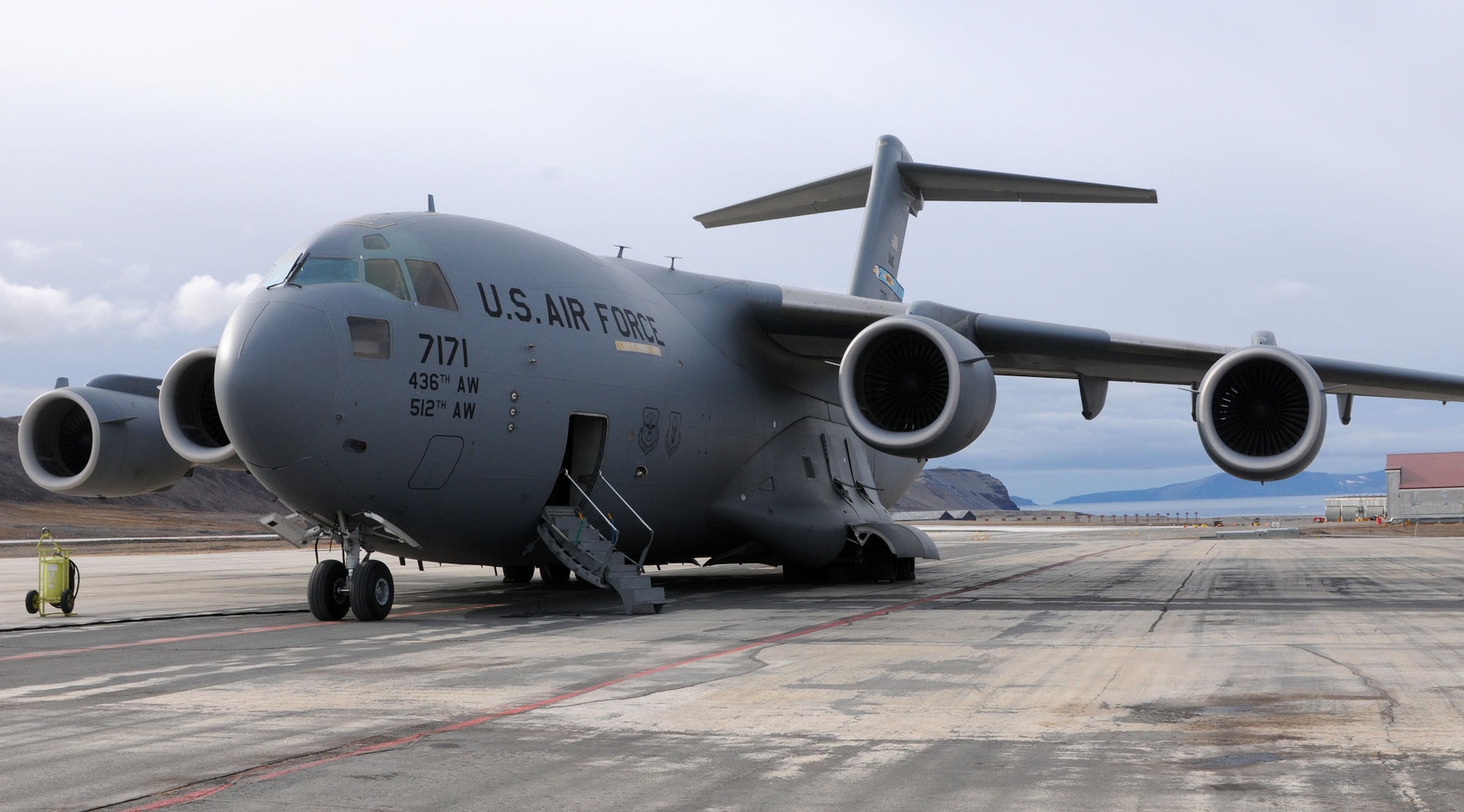 A Dover Air Force Base, Del., C-17 Globemaster III sits on the Thule Air Base, Greenland, runway Aug. 13, 2010. A 326th Airlift Squadron aircrew delivered a Halverson 25K-loader as part of the Canadian Operation BOXTOP. Supplies are staged at Thule AB and Canadian C-130s Hercules crews then deliver the cargo to Canadian Force Station Alert, 400 miles north of Thule. (U.S. Air Force photo/Capt. Marnee A.C. Losurdo)