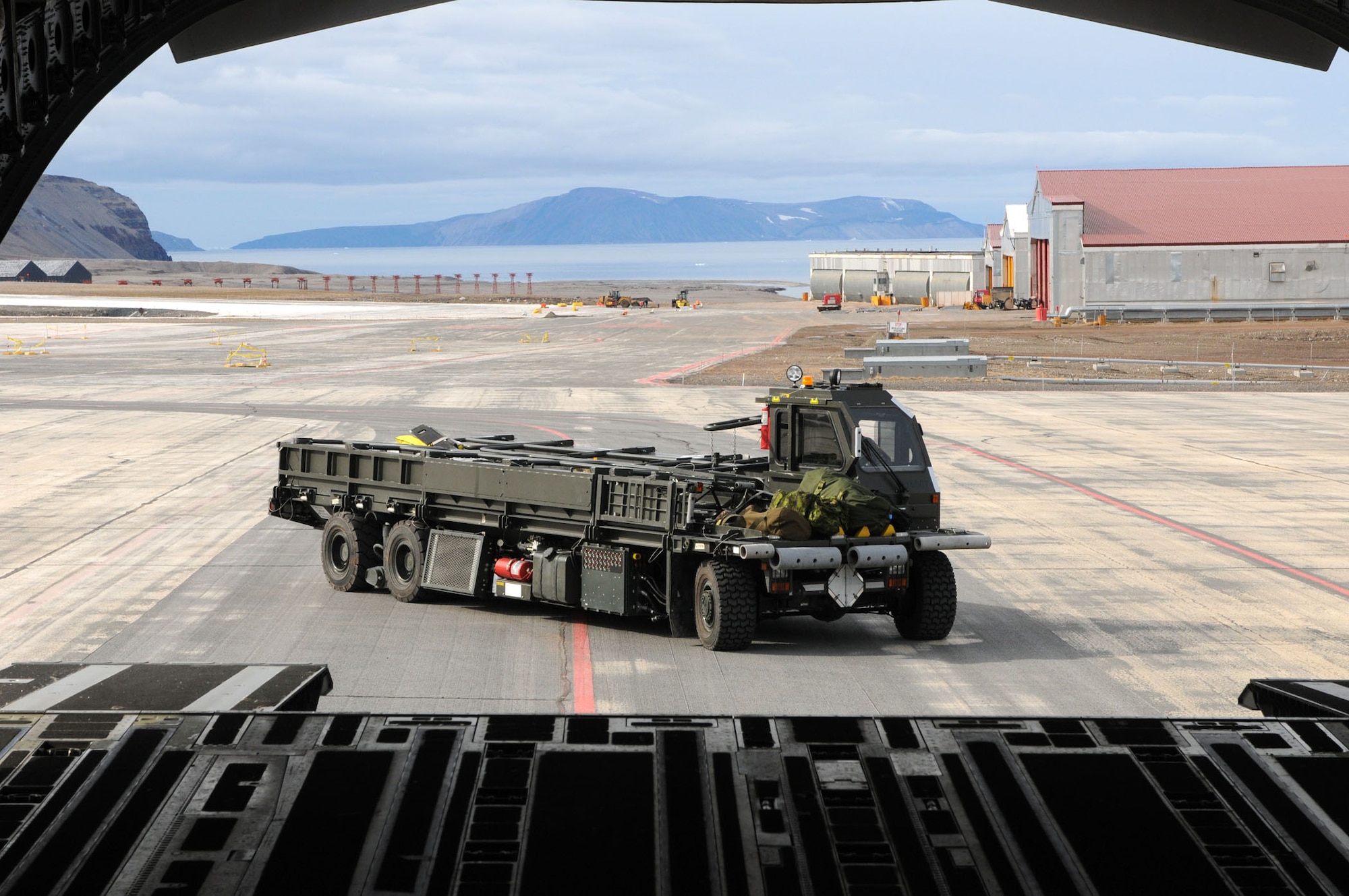 An Air Force Reserve 326th Airlift Squadron C-17 aircrew delivered a Halverson 25K-loader Aug. 13, 2010, to Thule Air Base, Greenland, as part of the Canadian Operation BOXTOP. The operation is conducted each spring and fall to provide supplies to the personnel stationed at Canadian Forces Stations Alert and Eureka on Ellesmere Island, Nunavut. Supplies are staged at Thule AB and Canadian C-130s Hercules crews then deliver the cargo to the Arctic bases, 400 miles north of Thule. (U.S. Air Force photo/Capt. Marnee A.C. Losurdo)