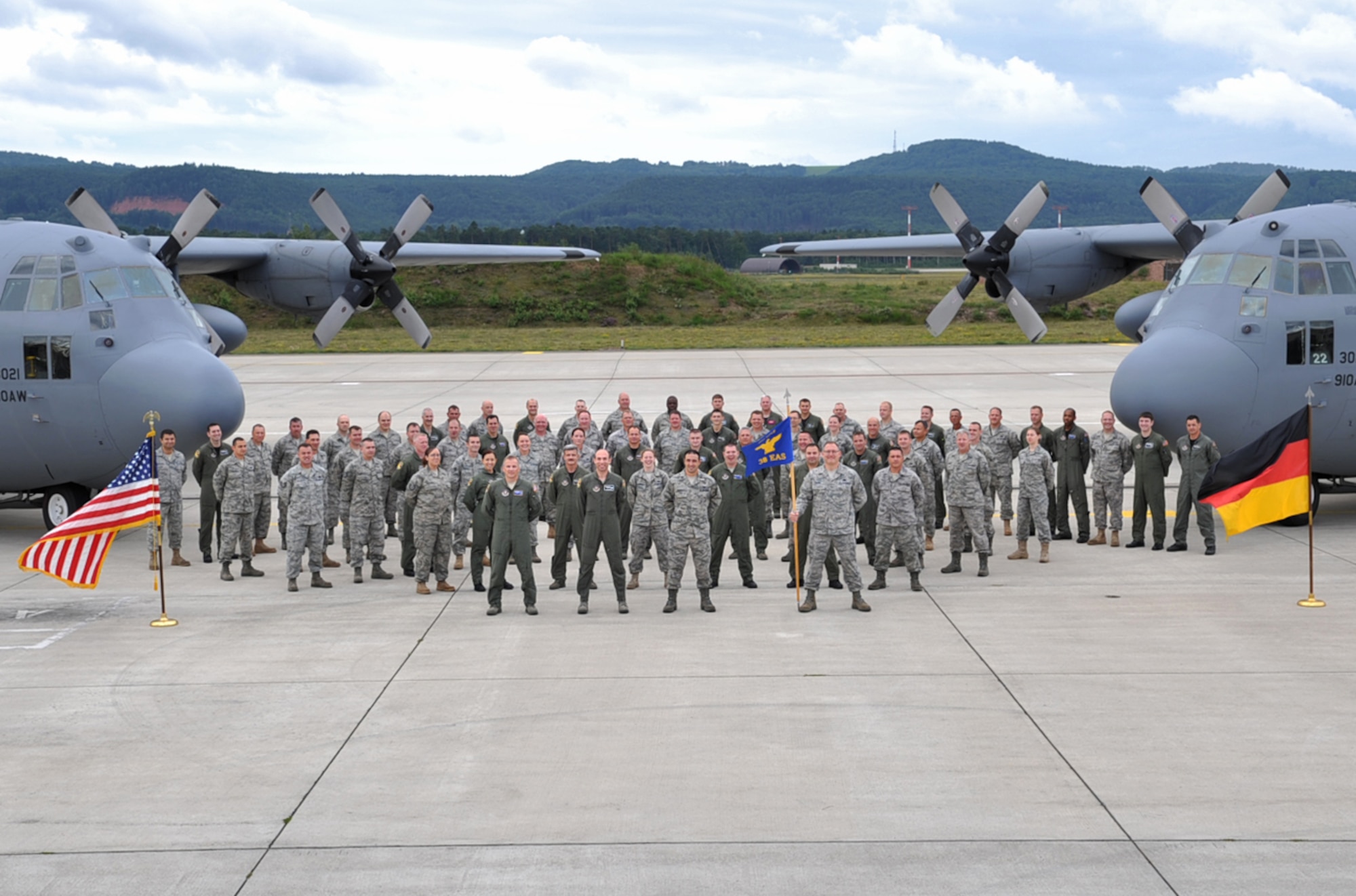 The 38th Expeditionary Airlift Squadron pose for a group photo on the flightline, Ramstein Air Base, Germany, Aug. 11, 2010. The squadon, which is made up of Air Force Reserve and Air National Guard personnel, will end their tour here on 15 Sept. after more than 20 years in Germany. (U.S. Air Force photo by Senior Airman Tony R. Ritter)