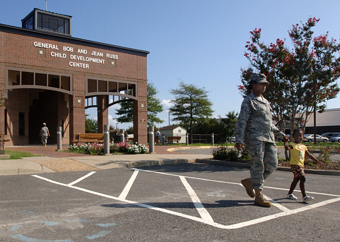 LANGLEY AIR FORCE BASE, Va. - Staff Sgt. Krystle Ward, 633d Civil Engineering Squadron SABER project manager, walks her daughter, Kennedi, to their car Aug. 15 after leaving the Child Development Center.  Sergeant Ward and many other active-duty parents can expect a change in their child-care rates beginning October 1. (U.S. Air Force photo/Tech. Sgt. Randy Redman)