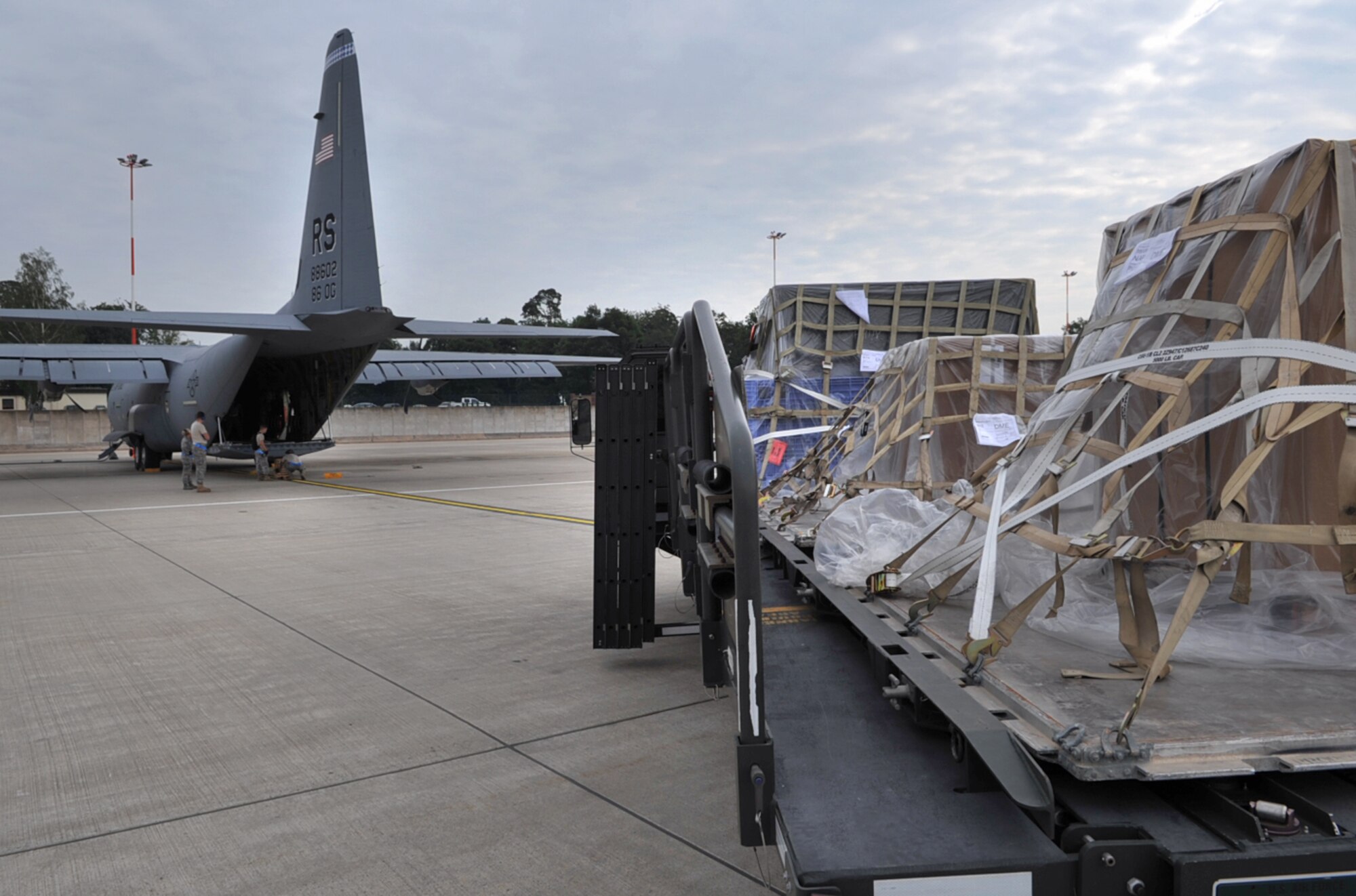 U.S. Air Force Airmen with the 721st Aerial Port Squadron load humanitarian relief cargo and equipment to an 86th Airlift Wing C-130J Super Hercules aircraft enroute to Russia, Ramstein Air Base, Germany, Aug. 13, 2010. Team Ramstein transported fire-fighting support equipment, in cooperation with a Department of Defense initiative to help Russia combat their ongoing wildfires. ( U.S. Air Force photo by Senior Airman Tony R. Ritter )