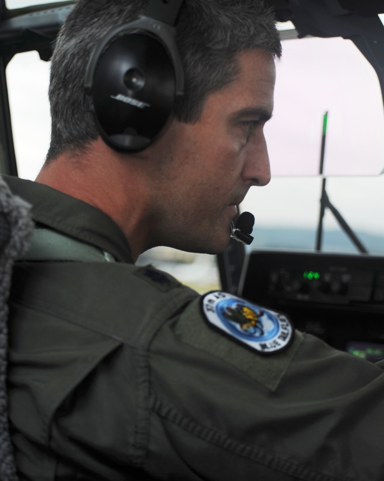 Lt. Col. Tobias Sernel, 37th Airlift Squadron commander, adjust flight controls in the cockpit of a C-130J as he prepares to take off from Trondheim Airport, Norway,  to deliver firefighting and humanitarian supplies to Moscow Aug. 14, 2010. The supplies are being delivered to Moscow after an official request from the Russian government to the U.S. and at the request of the Department of State. The Department of Defense directed U.S. European Command to provide valuable firefighting equipment that includes firefighting protective equipment and tools to help Russia combat the ongoing wildfires. (US Army photo by Staff Sgt. Lawree R Washington Jr)