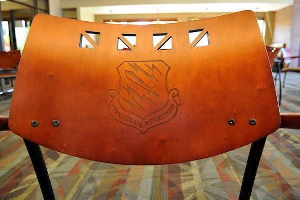 Details such as the laser-etched 21st Space Wing shield on chair backs give the Aragon dining facility the look and feel of a fine dining restaurant. The remodel and renovation project started in April and the facility officially reopened Aug. 6 with a ribbon-cutting ceremony and lunch for visitors. (U.S. Air Force photo/Rob Bussard) 