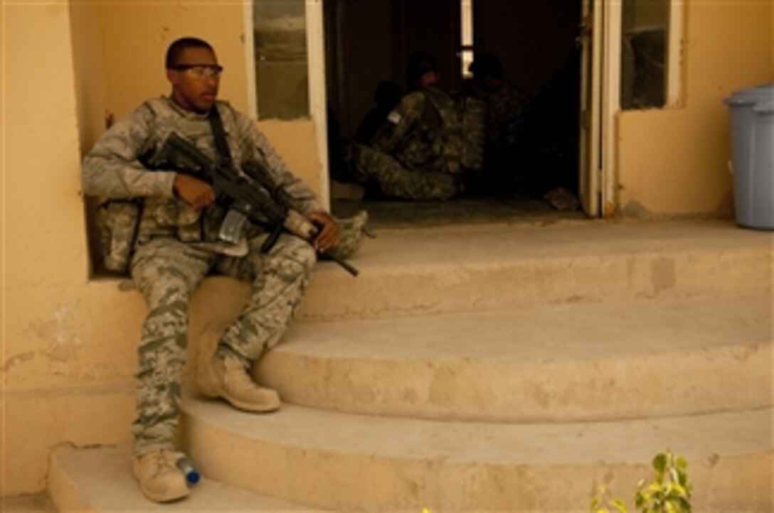 U.S. Air Force Senior Airman Xavier Baker, a communications specialist with Provincial Reconstruction Team Zabul, provides security outside a medical clinic near Combat Outpost Mizan, Zabul province, Afghanistan, on Aug. 13, 2010.  