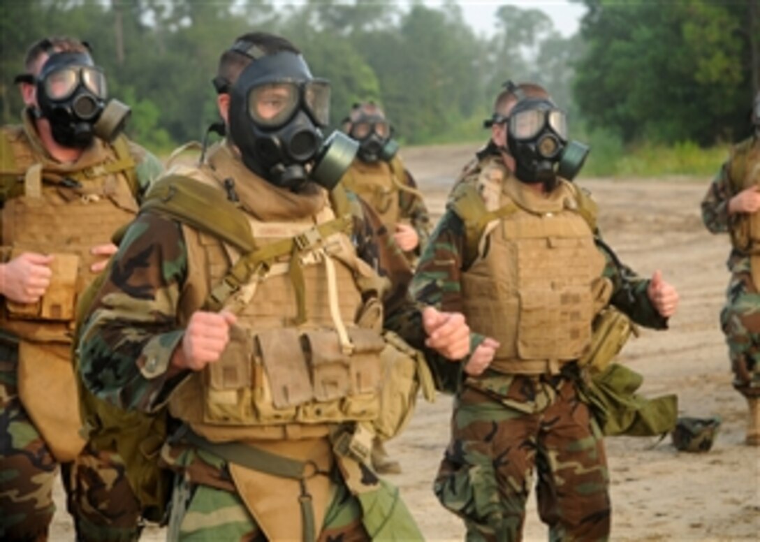 U.S. Navy sailors assigned to Naval Mobile Construction Battalion 74 run in place in full gear during a battalion readiness exercise at Naval Construction Battalion Center, Gulfport, Miss., on Aug. 6, 2010.  The exercise was designed to build strength, confidence and endurance in order to prepare the battalion for future missions and deployments.  