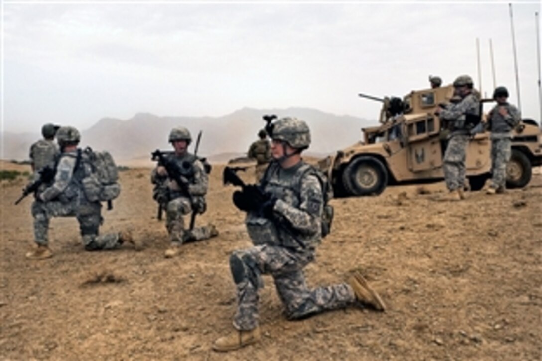 U.S. Army soldiers take a quick break during a dismounted patrol near Combat Outpost Mizan, Mizan District, Zabul province, Afghanistan, Aug. 16, 2010. The soldiers are assigned to  Company F, 2nd Squadron, 2nd Stryker Cavalry Regiment.