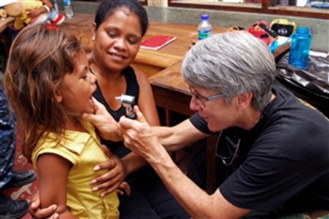 U.S. Navy Capt. Susan Dunn, a U.S. Public Health Service doctor, examines a child during a medical civic action program event in Dili, Timor-Leste, Aug. 12, 2010. The Military Sealift Command hospital ship USNS Mercy is in Timor-Leste supporting Pacific Partnership 2010, the fifth in a series of annual U.S. Pacific Fleet humanitarian and civic assistance endeavors to strengthen regional partnerships.