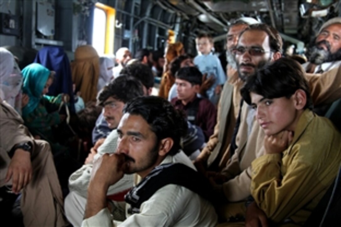 Pakistani flood victims takes flight aboard U.S. Marine Corps CH-53E Super Stallion helicopter attached to the HM-165, 15th Marine Expeditionary Unit, during humanitarian relief efforts in the Khyber-Pakhtunkhwa province, Pakistan, Aug. 17, 2010.