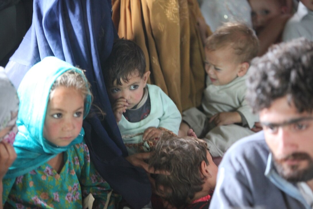 Young Pakistani flood victims take flight aboard Marine Super Stallion (CH-53E) helicopter attached to the HM-165 (REIN), 15th MEU during humanitarian relief efforts in the Khyber-Pakhtunkhwa province, Pakistan (formerly known as the Northwest Frontier province, Pakistan).