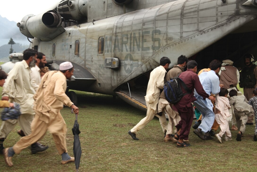 Pakistani citizens board Marine Super Stallion helicopters from HMM-165 (REIN), 15th MEU during humanitarian relief efforts in the Khyber-Pakhtunkhwa province, Pakistan (formerly known as the Northwest Frontier province, Pakistan).