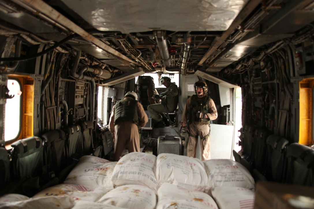 Marines from HMM-165 make final preparations before deliver relief supplies during humanitarian relief efforts in the Khyber-Pakhtunkhwa province, Pakistan (formerly known as the Northwest Frontier province).::r::::n::::r::::n::
