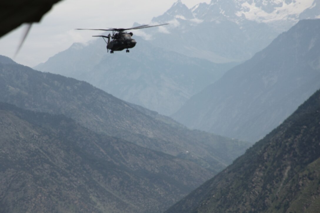 Navy Sea Dragon (MH-53E) helicopter attached to the HM-15 Det 2, 15th MEU navigates the countryside of Kalam Valley during humanitarian relief efforts in the Khyber-Pakhtunkhwa province, Pakistan (formerly known as the Northwest Frontier province, Pakistan).