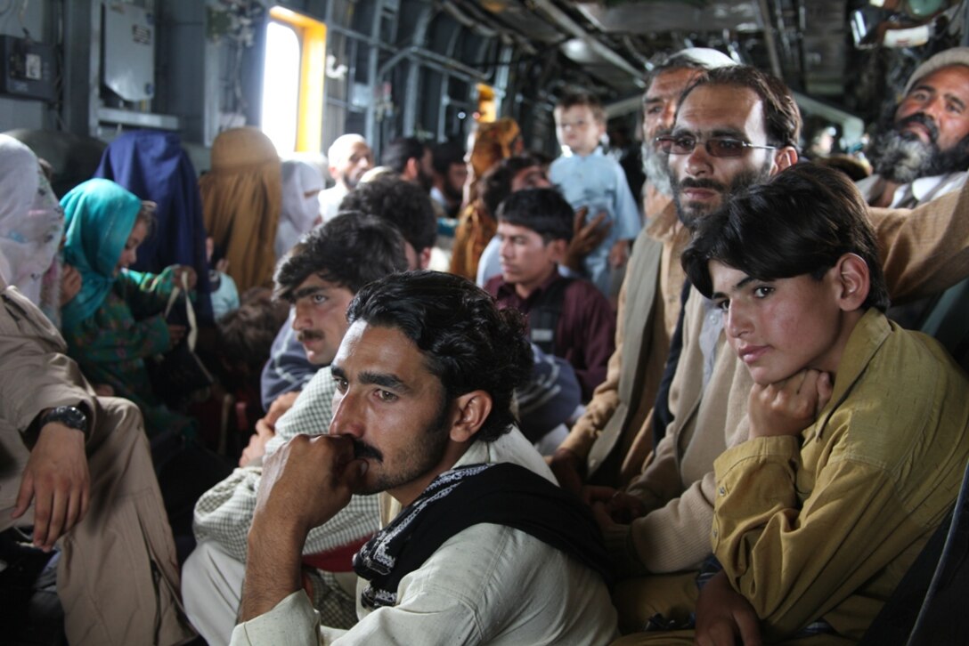 Pakistani flood victims take flight aboard Marine Super Stallion (CH-53E) helicopter attached to the HM-165 (REIN), 15th MEU during humanitarian relief efforts in the Khyber-Pakhtunkhwa province, Pakistan (formerly known as the Northwest Frontier province, Pakistan).