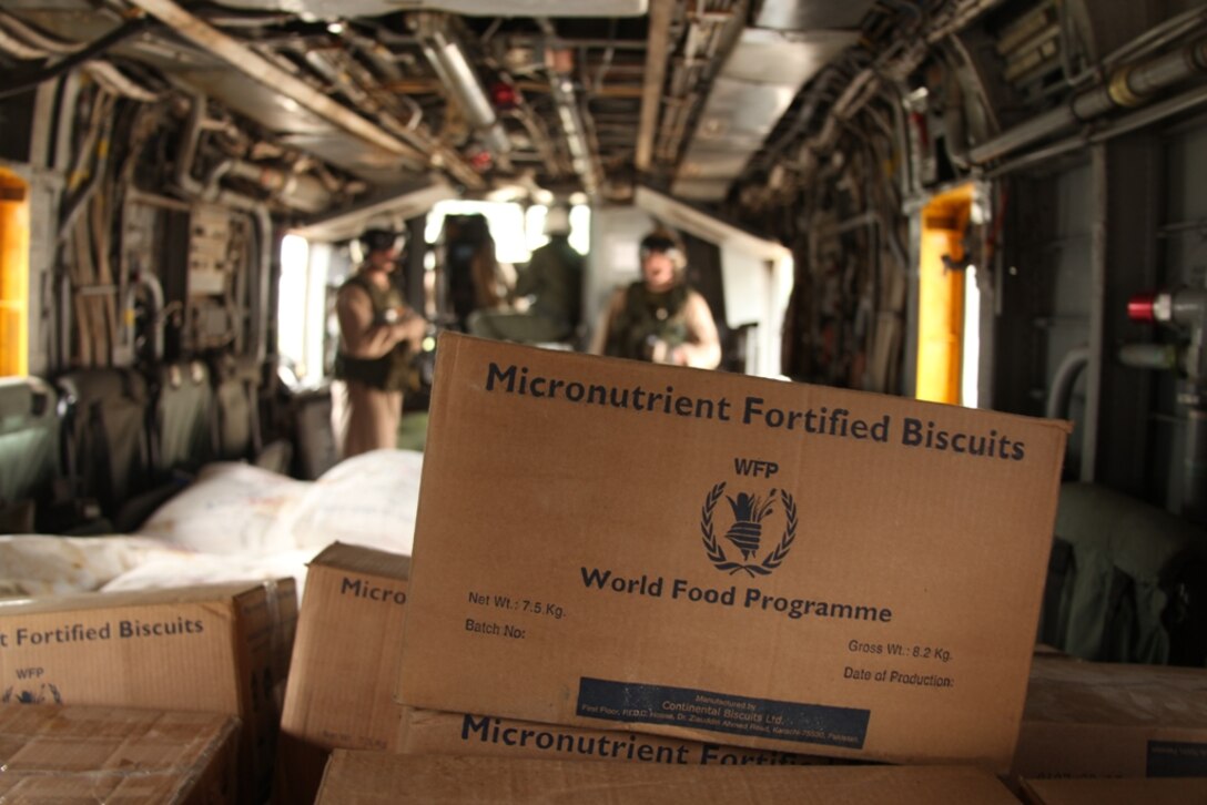 Marines from HMM-165 (REIN) make final preparations before deliver relief supplies during humanitarian relief efforts in the Khyber-Pakhtunkhwa province, Pakistan (formerly known as the Northwest Frontier province).