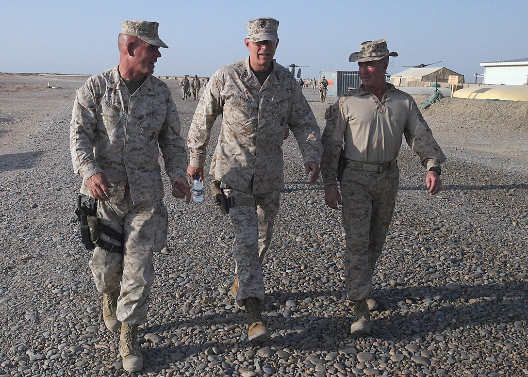 Commandant of the Marine Corps, Gen. James T. Conway, walks with Brig. Gen. Joseph Osterman, commanding general of 1st Marine Division [Forward] and Lt. Col. Scott Leonard, commanding officer of 1st Light Armored Reconnaissance Battalion, during a visit to Combat Outpost Payne, Aug. 18. During the commandant’s visit, he walked through COP Payne, stopping to speak with Marines in their working in the area.