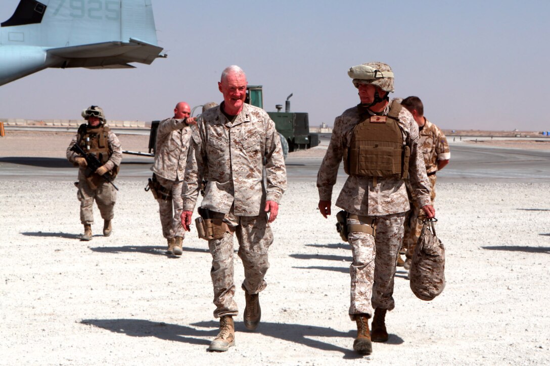 Regional Command Southwest commander, Maj. Gen. Richard P. Mills greets Commandant of the Marine Corps Gen. James T. Conway, at Camp Bastion Aug. 18. Conway, accompanied by Sergeant Major of the Marine Corps Sgt. Maj. Carlton Kent,  visited Marines and sailors deployed to Afghanistan, Aug. 18-20.
