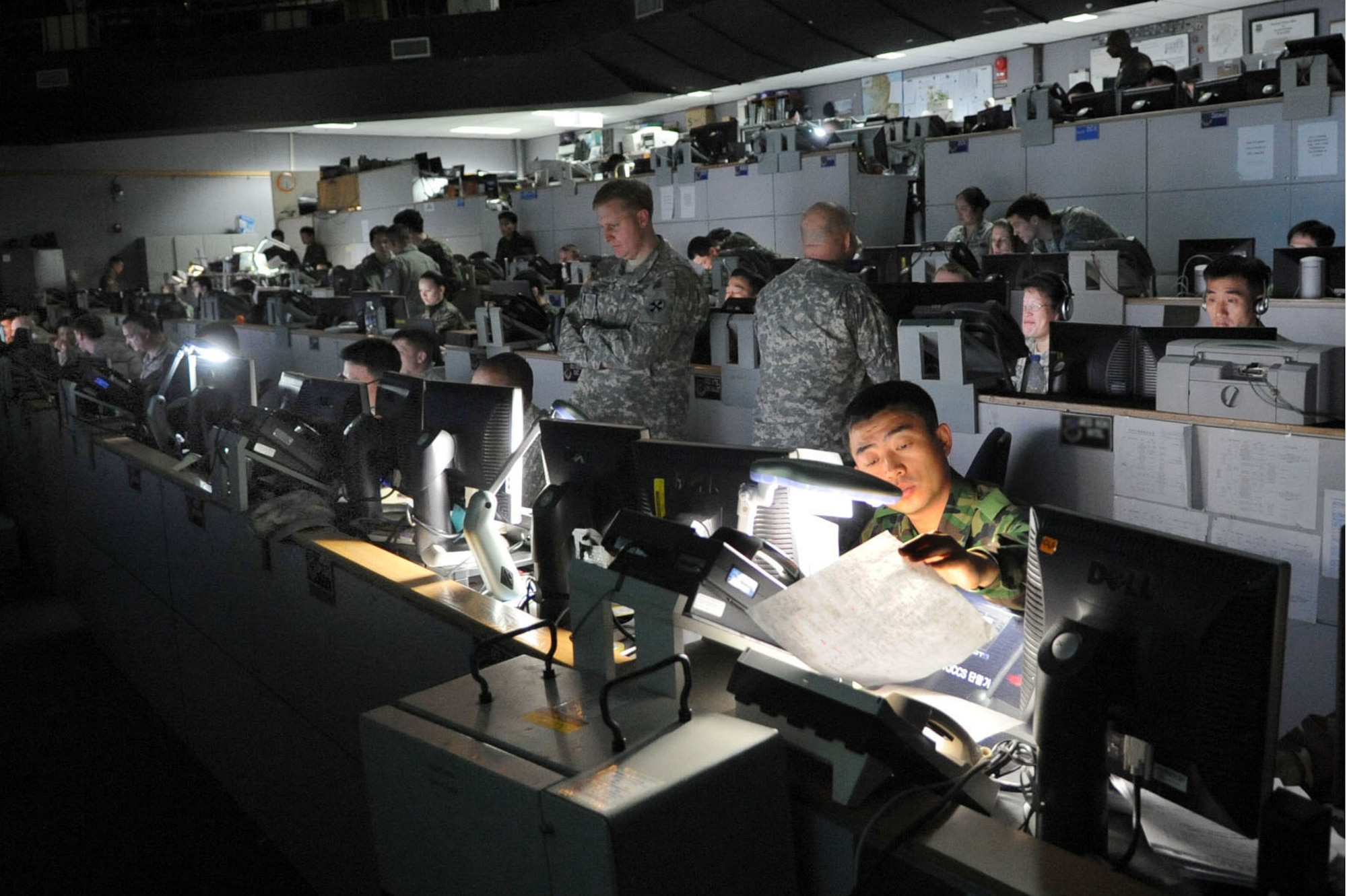 American and Korean servicemembers conduct operations at the Korea Air Operations Center at Osan Air Base, South Korea, during an exercise earlier this year. More than 27,000 American and 500,000 South Korean servicemembers currently are participating in Exercise Ulchi Freedom Guardian which runs from Aug. 16 to Aug. 26, 2010. This year marks the 34th anniversary of the joint/combined exercise. (U.S. Air Force photo illustration)