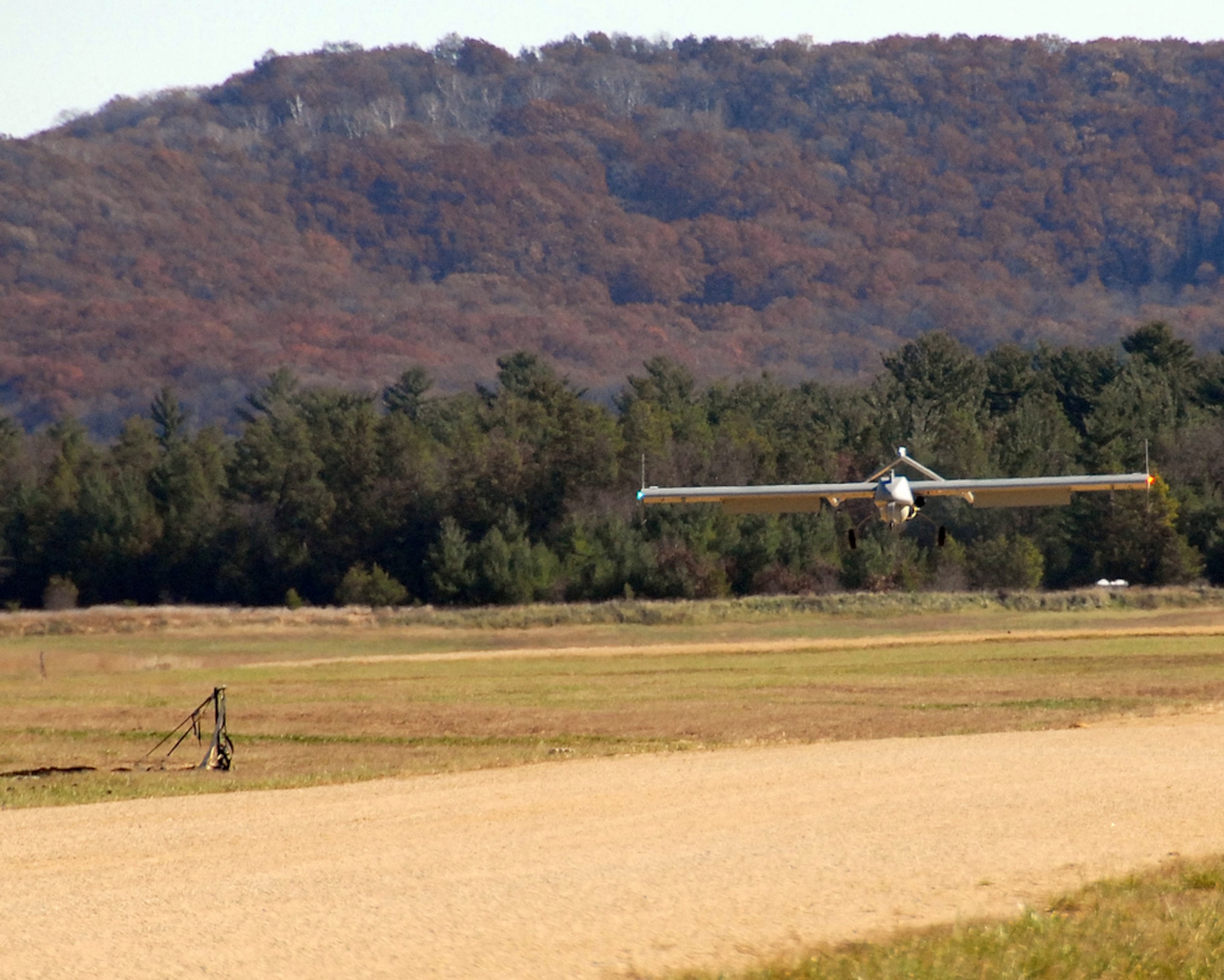 An RQ-7 Shadow 200 unmanned aerial vehicle prepares to land Nov. 2, 2009 during a training mission at Fort McCoy. A platoon with Company B, Brigade Special Troops Battalion, 32nd Infantry Brigade Combat Team will operate the UAVs at Volk Field, where a new $8 million facility is planned. Wisconsin National Guard photo by 1st Sgt. Vaughn R. Larson
