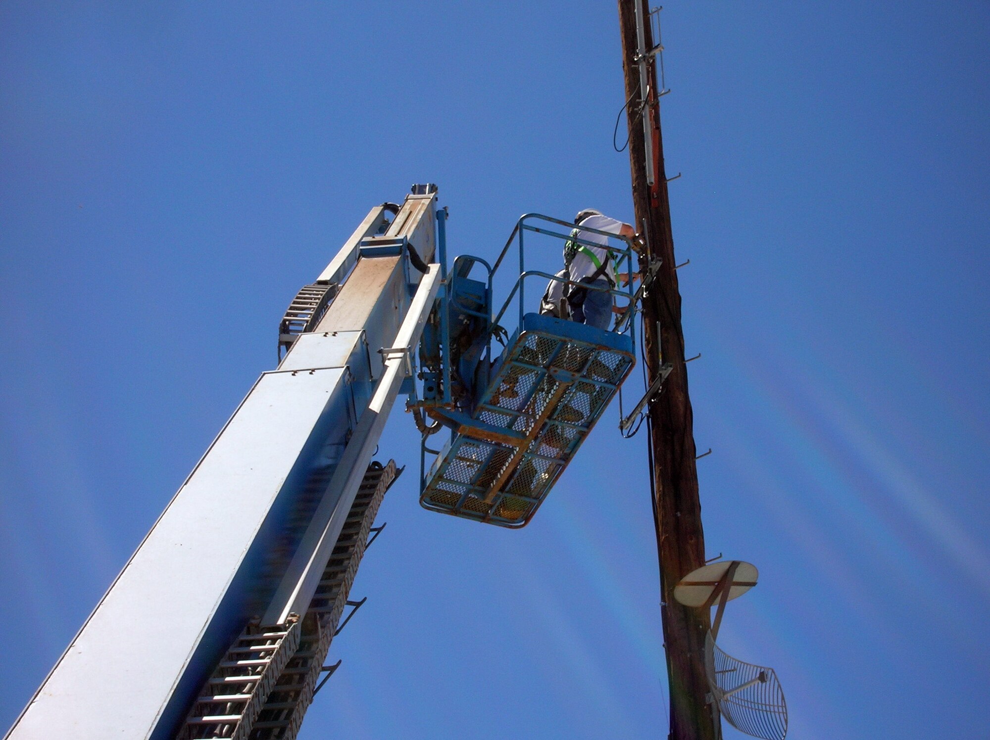 Contractors install the receiving antennae for an automated gas and electric meter reading system at Holloman Air Force Base, N.M. The Air Force is currently funding more than $5 million in energy conservation projects at Holloman AFB. (Courtesy photo)