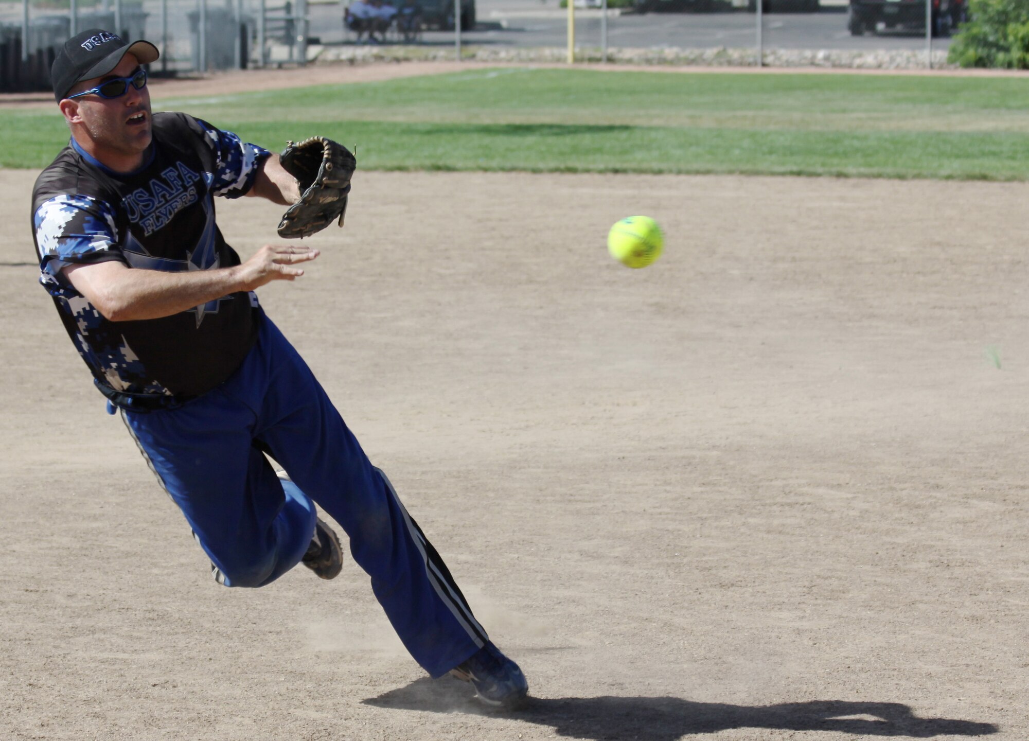 Fred Walker throws to first base to force an out during the Colorado varsity softball championship in Loveland, Colo., Aug. 7, 2010. Walker plays for the Air Force Academy Flyers, who won the state championship. (U.S. Air Force photo/Wade Dolbow)