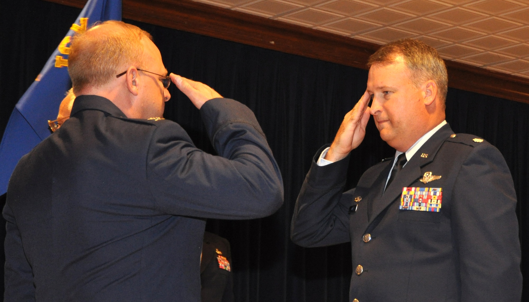 Lt. Col. Steven Foss (right) salutes Col. Kurt D. Jones while assuming command of the 731st Airlift Squadron Aug. 8 at Peterson Air Force Base, Colo. Colonel Foss, an Air Force Reserve C-130 navigator, took command of squadron from outgoing commander, Col. Courtney Arnold. As commander of the airlift squadron, Colonel Foss is responsible for the dozens of aircrews who fly 12, C-130H3 Hercules tactical aircraft, which are assigned to the 302nd Airlift Wing. Colonel Foss is a master navigator with more than 4,500 flight hours. Colonel Jones commands the 302nd Operations Group, a parent organization to the 731st AS. (U.S. Air Force photo/Larry Hulst)