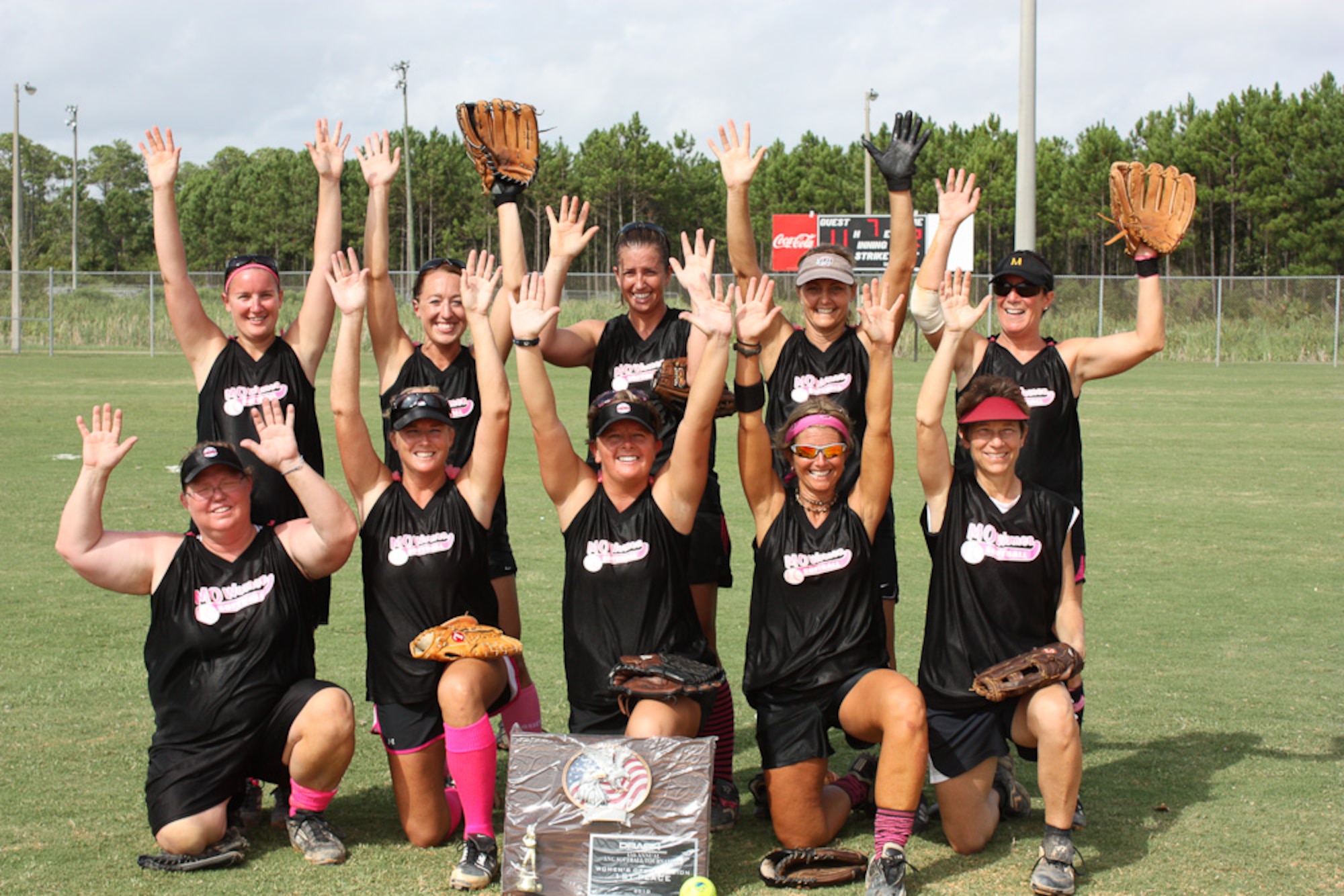 139th Airlift Wing Women's team pose "Hands UP..." with their Championship trophy.  Left to right (back row): Tiffany Beckett, Rachel Malchose, Jaimie Wolf, Marilyn Rongey, Tanya Douglas; (front row): Denise Paden, Lesa Anderson, Heather Mitchell, Jill Johnson, Kim Moore. The 45th annual Air National Guard Softball trournament was held in Panama City, Florida, August 12 - 15, 2010. (U.S. Air Force photo by Lt.Col. Carl Johnson)