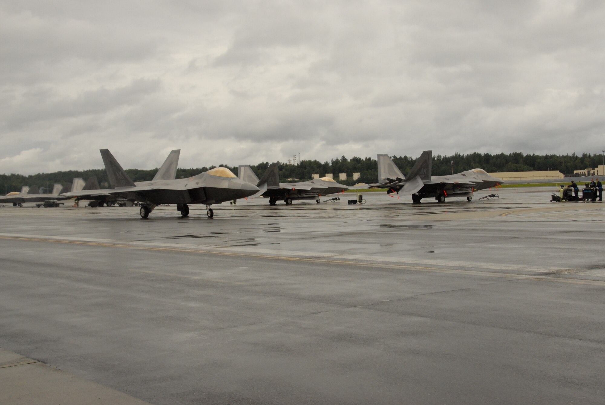 F-22’s assigned to the 3rd Wing taxi to the main runway during Red Flag Alaska Aug. 18. Reserve and Active Duty pilots and maintainers assigned to the 477th Fighter Group and 3rd Wing, respectively, integrate in nearly all areas of F-22 operations. (U.S. Air Force/Capt. Ashley Conner)