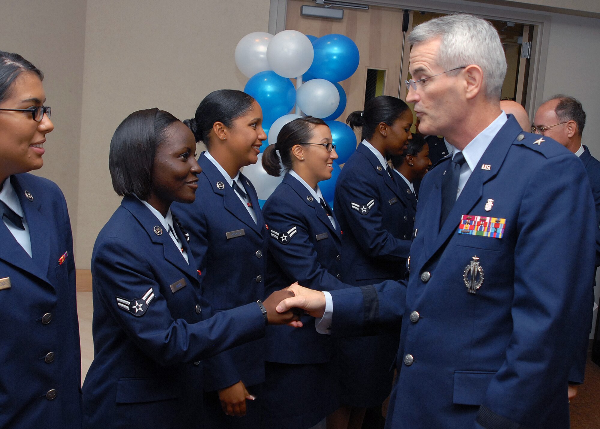 Brig. Gen. Michael Miller congratulates an Airman from Class 100625 during the Health Services Management Apprentice course graduation ceremony Aug. 17, celebrating the last 4A0X1 students to be trained at Sheppard Air Force Base, Texas.  General Miller is the Assistant Surgeon General, Strategic Medical Plans, Programs and Budget, and Chief of the Medical Service Corps, Office of the Surgeon General, Arlington, Va., and was a distinguished visitor for the event.  The 882nd Training Group’s HSMA course is moving to the Medical Enlisted Training Campus at Fort Sam Houston in San Antonio, Texas.  General Miller is also the former commander of the 82nd Medical Group.  (U.S. Air Force photo/Tech. Sgt. Vernon Cunningham)