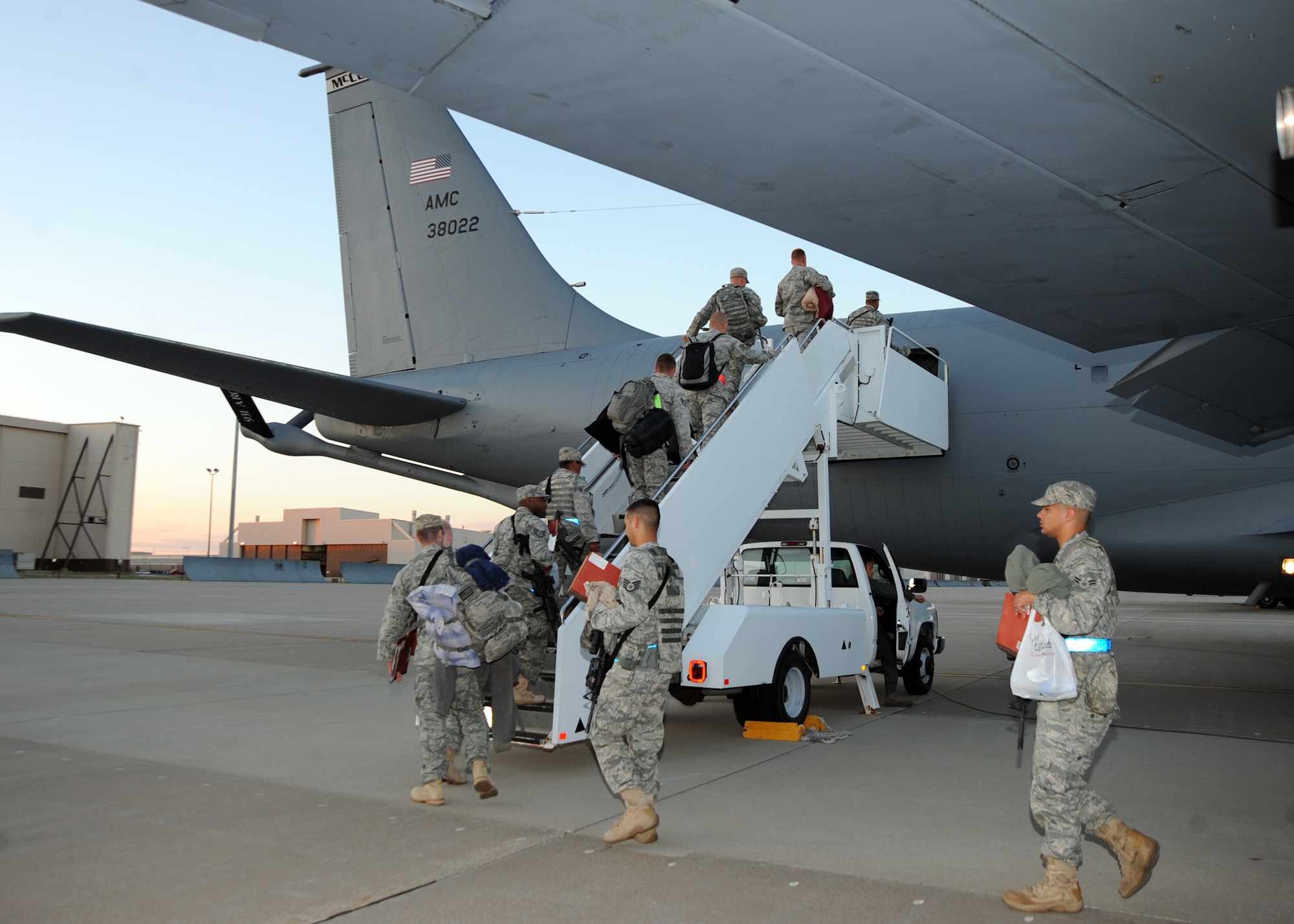Team McConnell Airmen board a KC-135 Stratotanker during an operational readiness exercise Aug. 16, 2010, McConnell Air Force Base, Kan.  More than 100 Airmen deployed to an Air Force base in the United States during an exercise to test the base’s ability to provide rapid mobility and air refueling support.  Exercises are structured scenarios that give McConnell personnel and leaders the opportunity to sharpen their skills and test new tactics. (U.S. Air Force photo/Airman 1st Class Andrea Salazar)