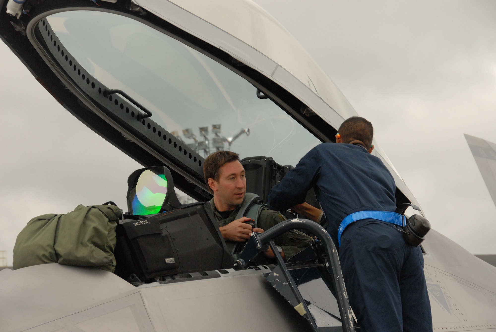 Maj. Chad Feucht, a Reserve F-22 pilot assigned to the 477th Fighter Group, prepares for a sortie during Red Flag Alaska 10-4. In his civilian job Major Feucht is Lockheed-Martin’s lead F-22 mission support software engineer for the 3rd Wing. (U.S. Air Force/Capt. Ashley Conner)