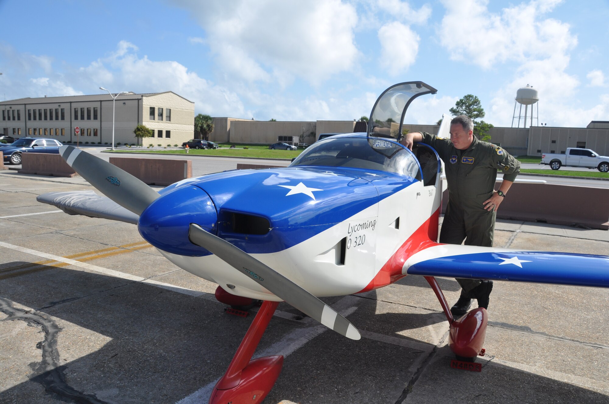Major Benjamin Cook, 95th Fighter Squadron F-15 Instructor Pilot and Assistant Director of Operations, stands beside his ‘ride’ to work, otherwise known as his Glasair experimental aircraft where he parks it daily at Tyndall Air Force Base.  (U.S. Air Force photo/Senior Airman Veronica McMahon)
