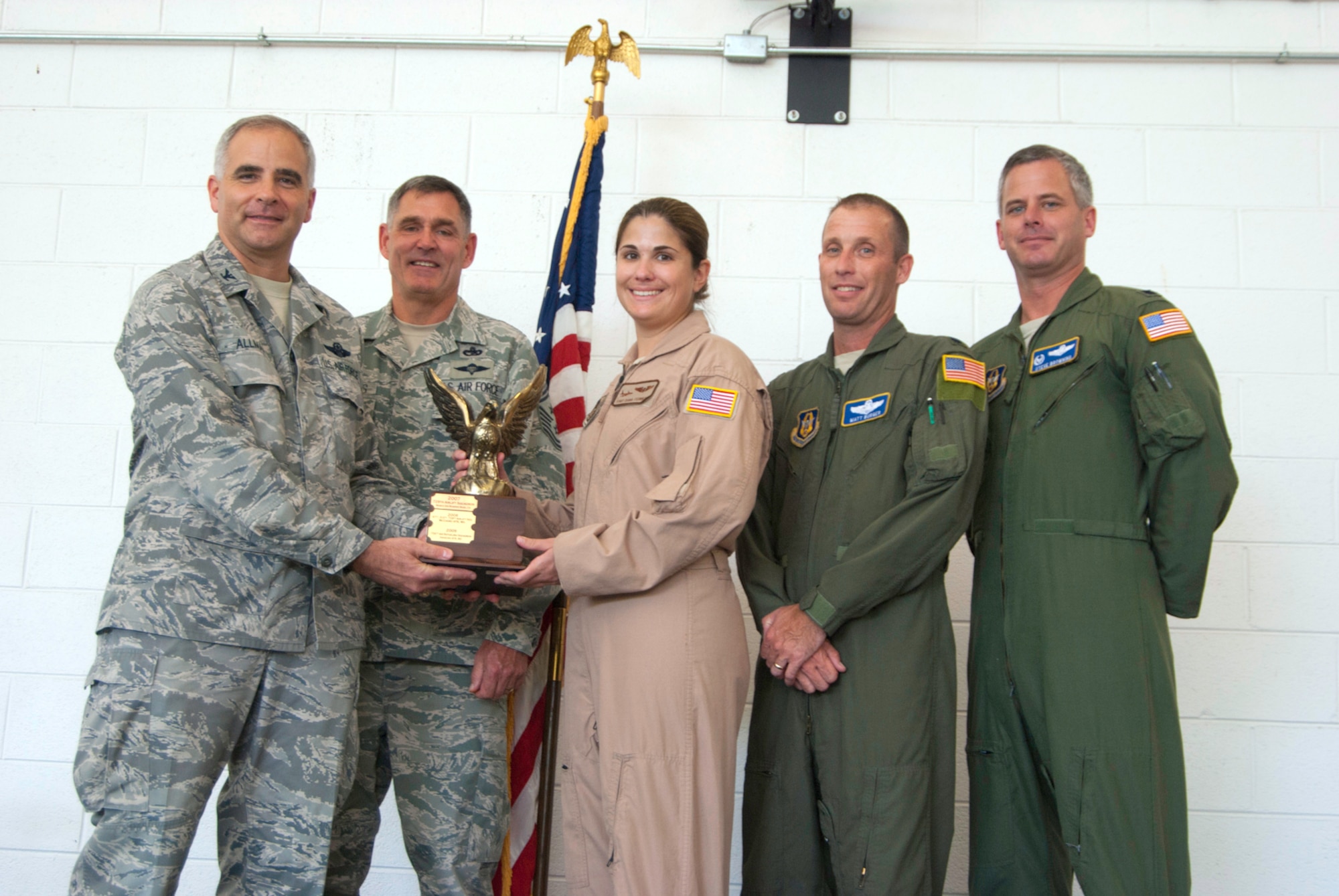 JOINT BASE ANDREWS, Md. -- Col. James M. Allman (far left), 459th Air Refueling Wing commander, recognizes a 756th Air Refueling Squadron aircrew for winning the 4th Air Force Aircrew Excellence award during a commander's call here Aug. 14. The commander's call was held in conjunction with the wing's 2010 Family Day, which provide family members with a fun afternoon of activites, a KC-135R Stratotanker tour, food and music. (U.S. Air Force photo/Staff Sgt. Sophia Piellusch)