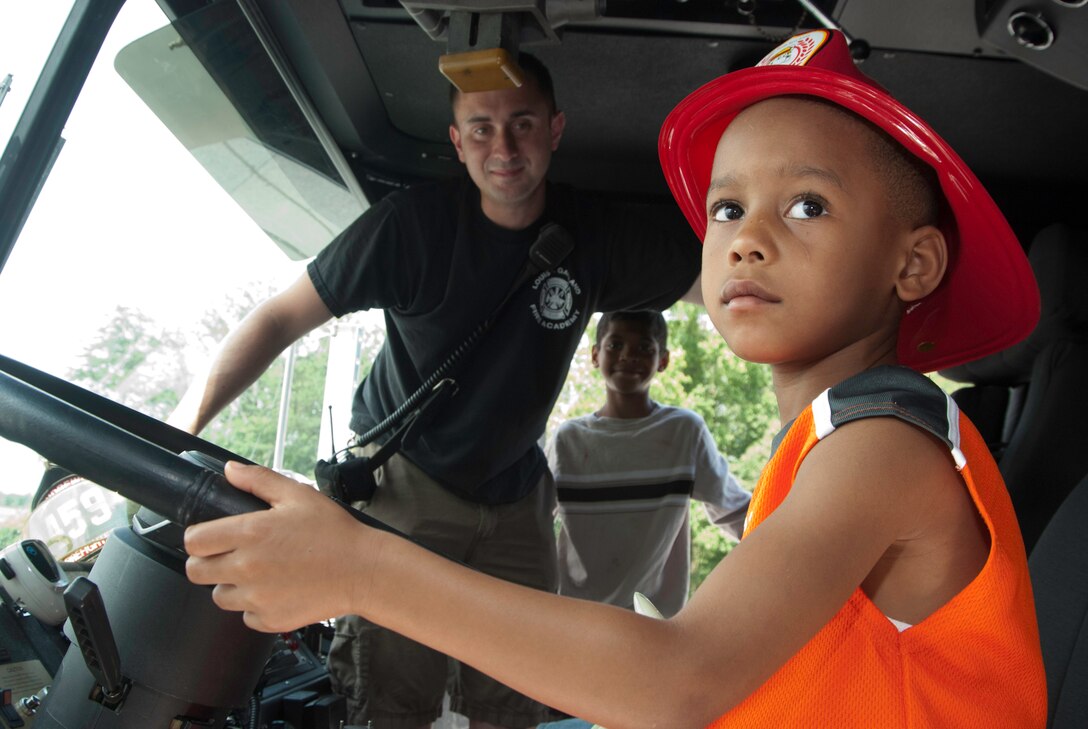 JOINT BASE ANDREWS, Md. -- Family members of 459th Air Refueling Wing Airmen enjoy a fun afternoon of activities, touring a static display of a KC-135R Stratotanker, food and music, here Aug 14. The Family Day Event also recognized the support family members have given to wing servicemembers over the past year. (U.S. Air Force photo/Staff Sgt. Sophia Piellusch)