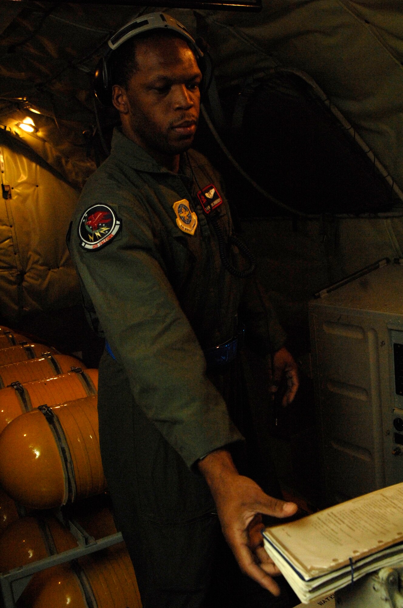 Senior Airman Theodore Dinwiddie, 350th Air Refueling Squadron boom operator, performs final inspections on a KC-135 Stratotanker Aug. 17, 2010, Grand Forks Air Force Base, N.D.  Four of McConnell's 63 KC-135s were utilized during a historical operational readiness exercise that required McConnell Airmen to forward deploy to Grand Forks.  (U.S. Air Force photo/Senior Airman Abigail Klein)