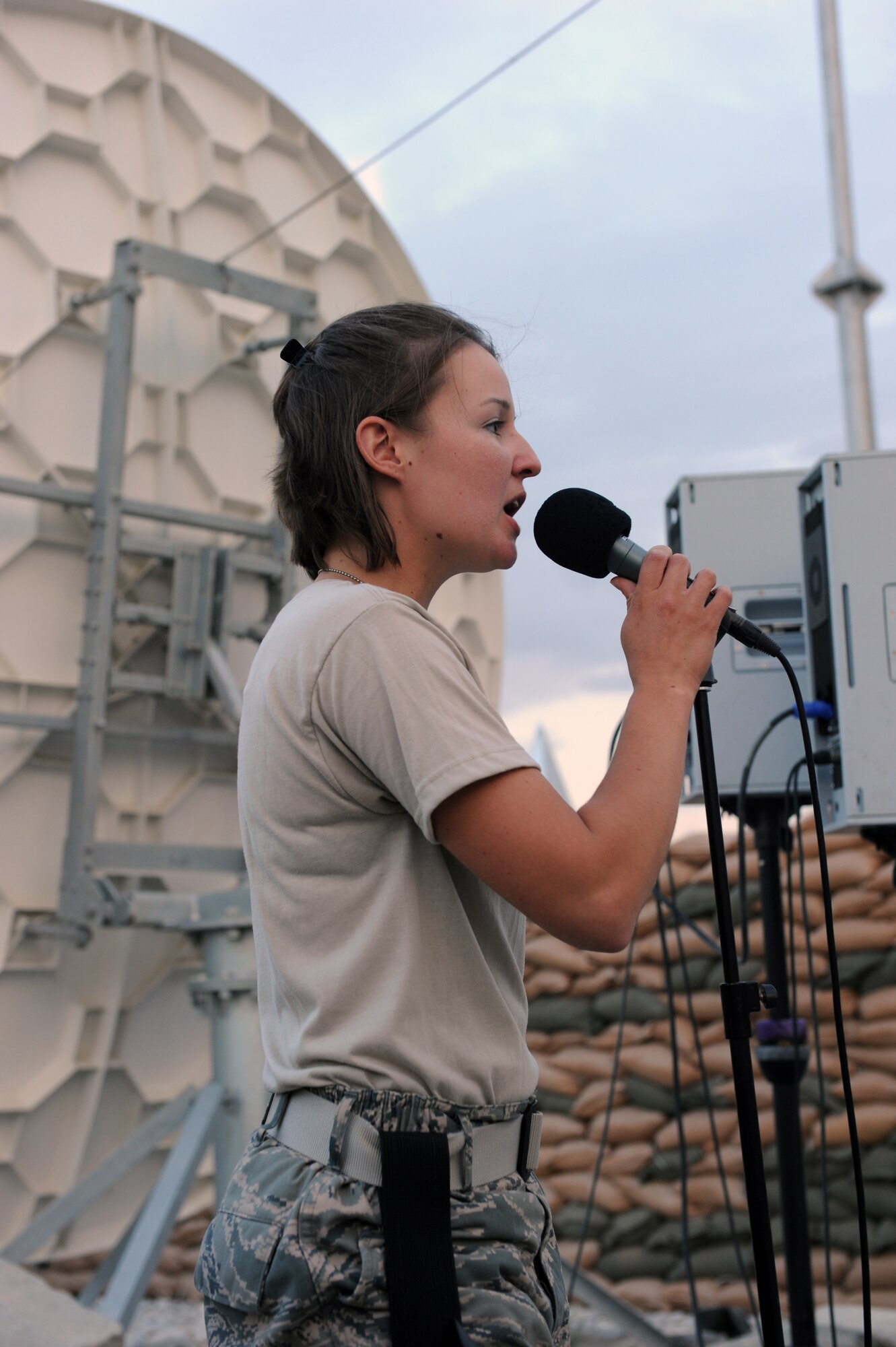 Staff Sgt. Jamie Hibbert, vocalist, sings for servicemembers during a performance at Bagram Airfield, Afghanistan Aug., 12, 2010. The AFCENT band for this rotation is ?New Horizons,? the Massachusetts Air Guard Band. (U.S. Air Force Photo/Tech. Sgt. Drew Nystrom)
