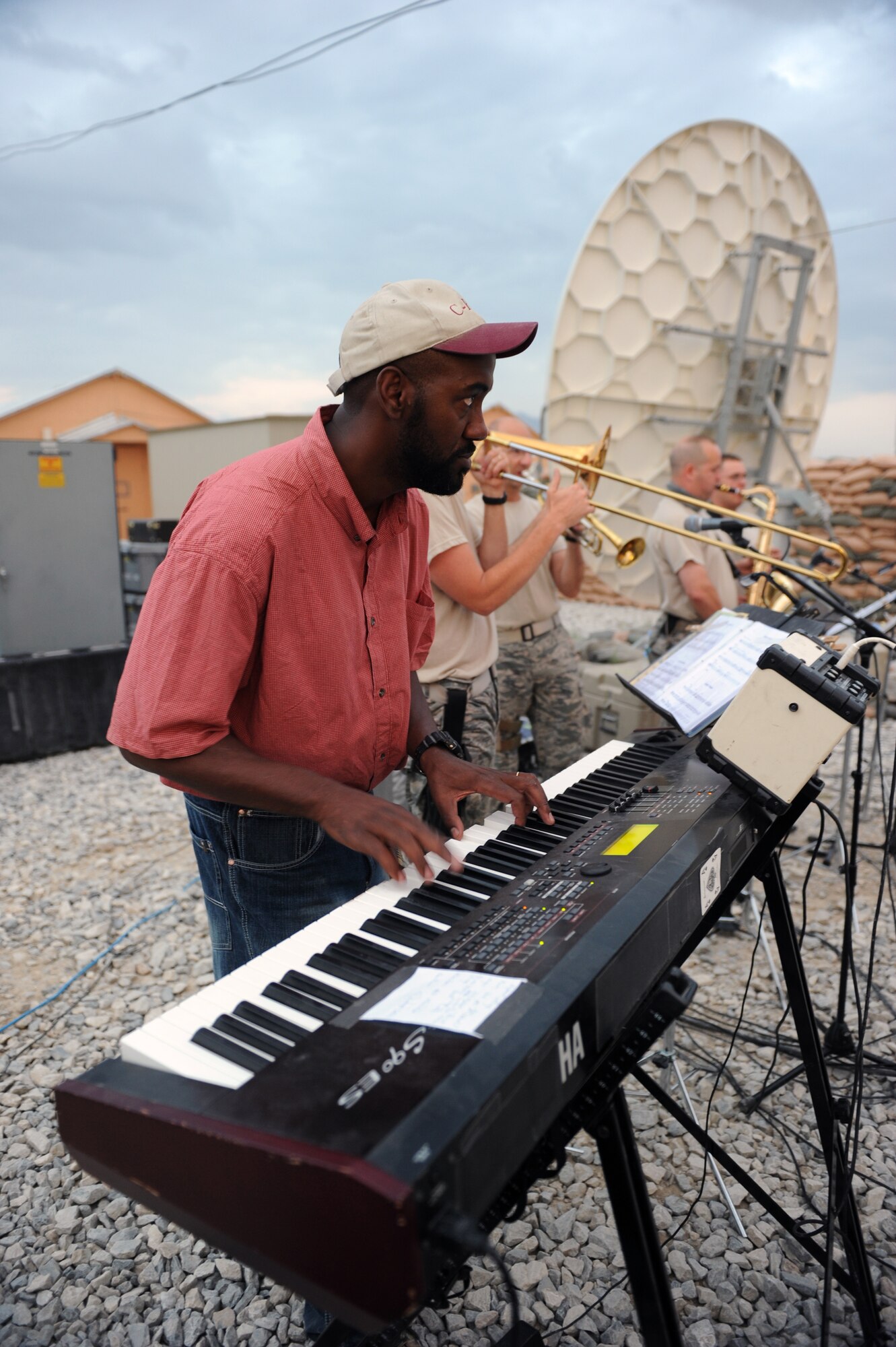 Mike Chipman, a civilian contractor here at Bagram Airfield, Afghanistan, sits-in with the AFCENT band during a performance here, Aug., 12, 2010. Chipman is a native of Ft. Hood, Texas. The AFCENT band for this rotation is ?New Horizons,? the Massachusetts Air Guard Band. (U.S. Air Force Photo/Tech. Sgt. Drew Nystrom)