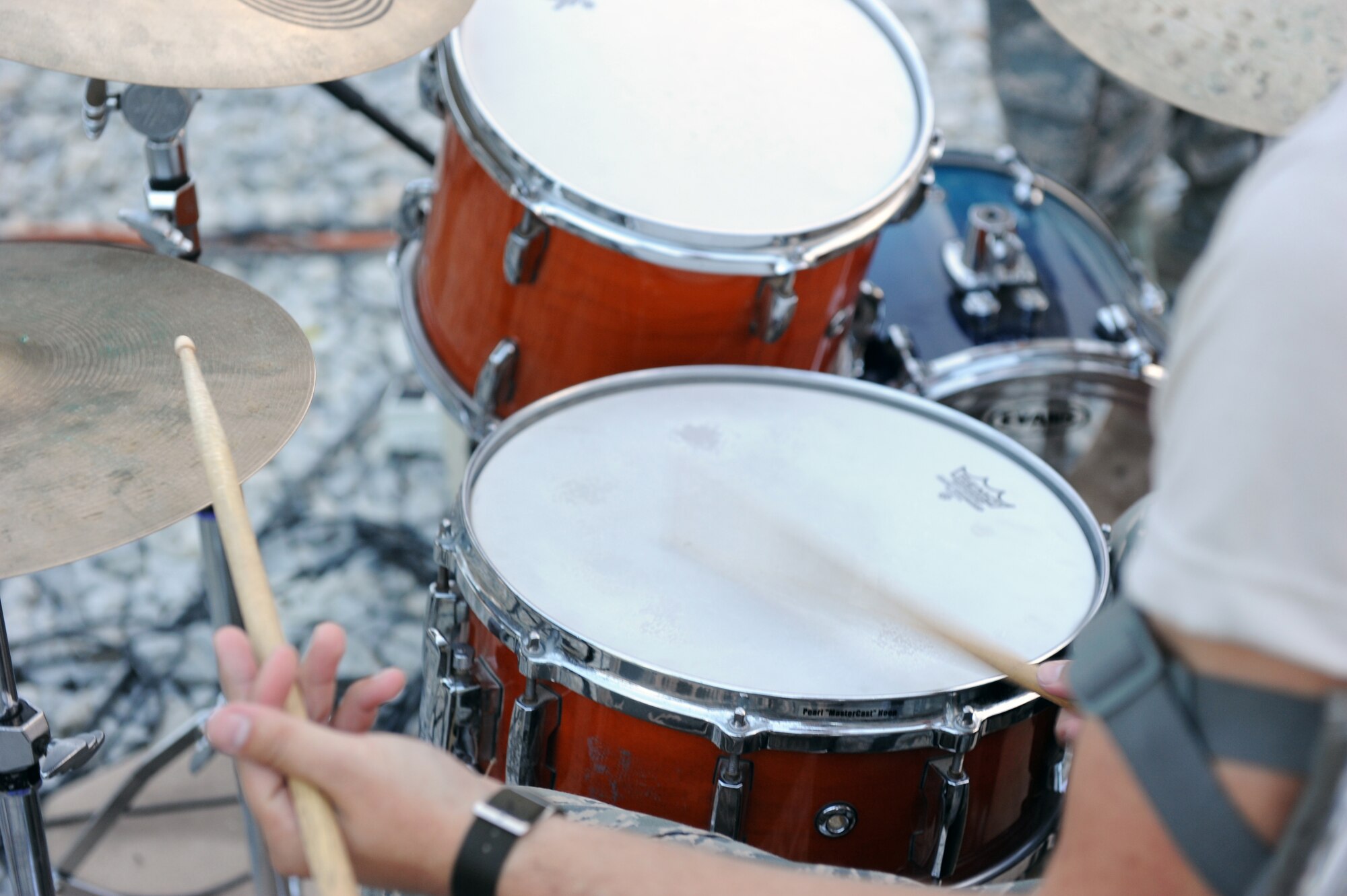Tech. Sgt. Adam Benham, drummer, performs for servicemembers during a performance at Bagram Airfield, Afghanistan Aug., 12, 2010. The AFCENT band for this rotation is ?New Horizons,? the Massachusetts Air Guard Band. (U.S. Air Force Photo/Tech. Sgt. Drew Nystrom)