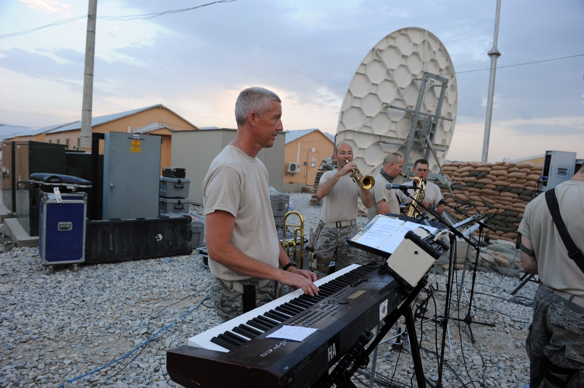 Master Sgt. Tony Cyrus, keyboard player, performs for servicemembers during a performance at Bagram Airfield, Afghanistan Aug., 12, 2010. The AFCENT band for this rotation is ?New Horizons,? the Massachusetts Air Guard Band. (U.S. Air Force Photo/Tech. Sgt. Drew Nystrom)