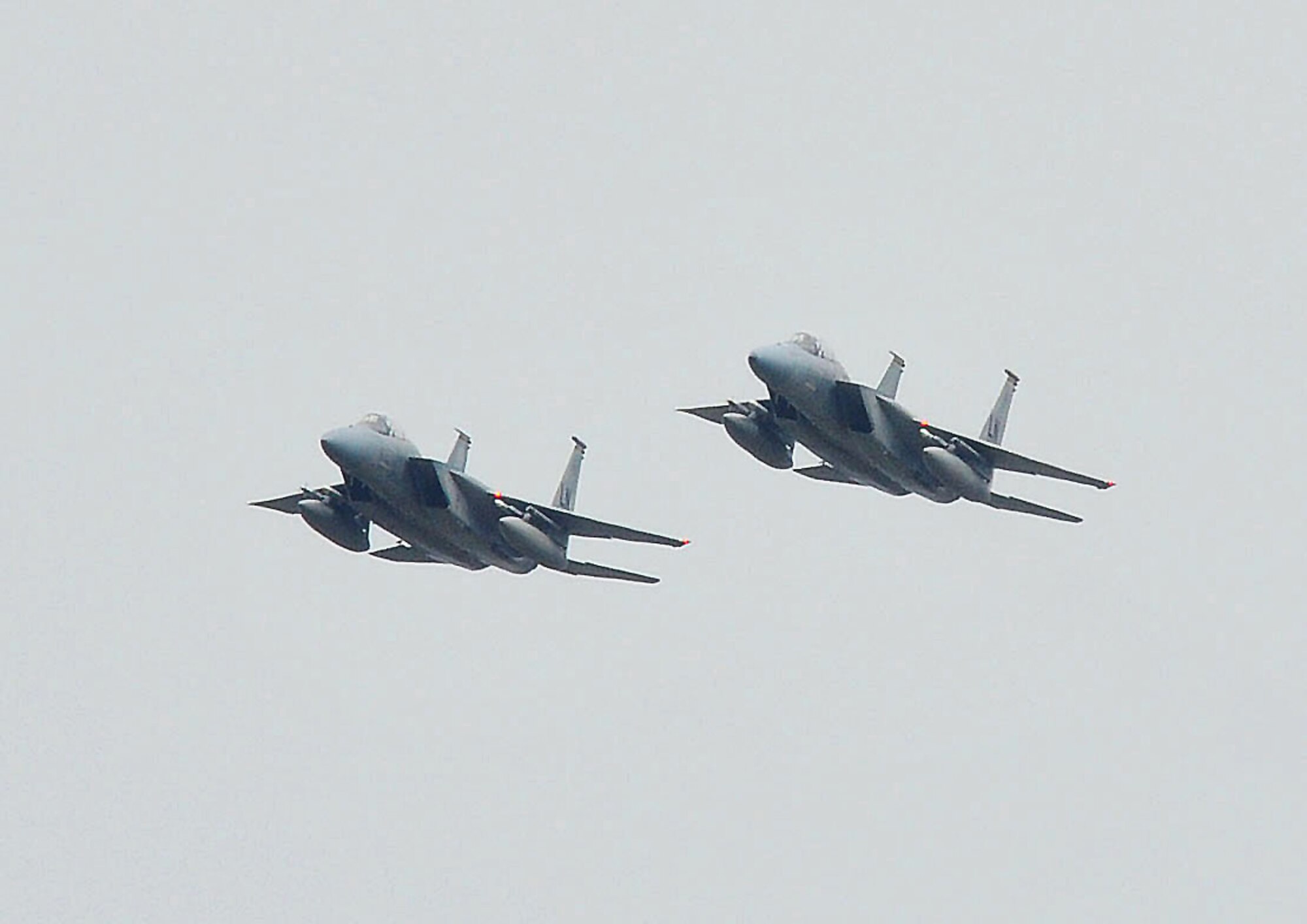 Two F-15s from the 493rd Fighter Squadron perform a flyover during the Heart Air Display and Classic Car Show at Rougham Airfield, Bury St. Edmunds, England, Aug. 15. The flyover represents continued efforts to build partnerships between the city of Bury St. Edmunds and the U.S. Air Force in England and was seen by several thousand people who attended the event.  (U.S. Air Force photo by Staff Sgt. Connor Estes)