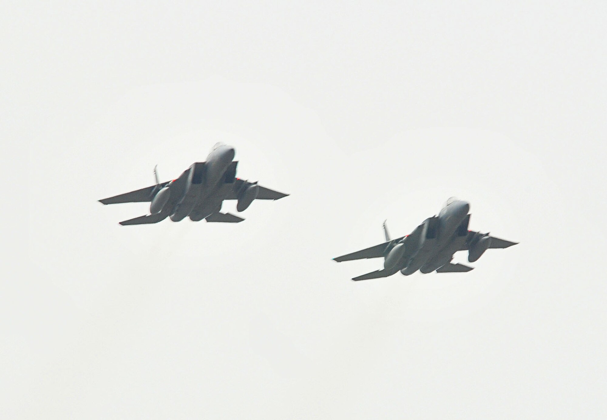 Two F-15s from the 493rd Fighter Squadron perform a flyover during the Heart Air Display and Classic Car Show at Rougham Airfield, Bury St. Edmunds, England, Aug. 15. The flyover represents continued efforts to build partnerships between the city of Bury St. Edmunds and the U.S. Air Force in England and was seen by several thousand people who attended the event.  (U.S. Air Force photo by Staff Sgt. Connor Estes)