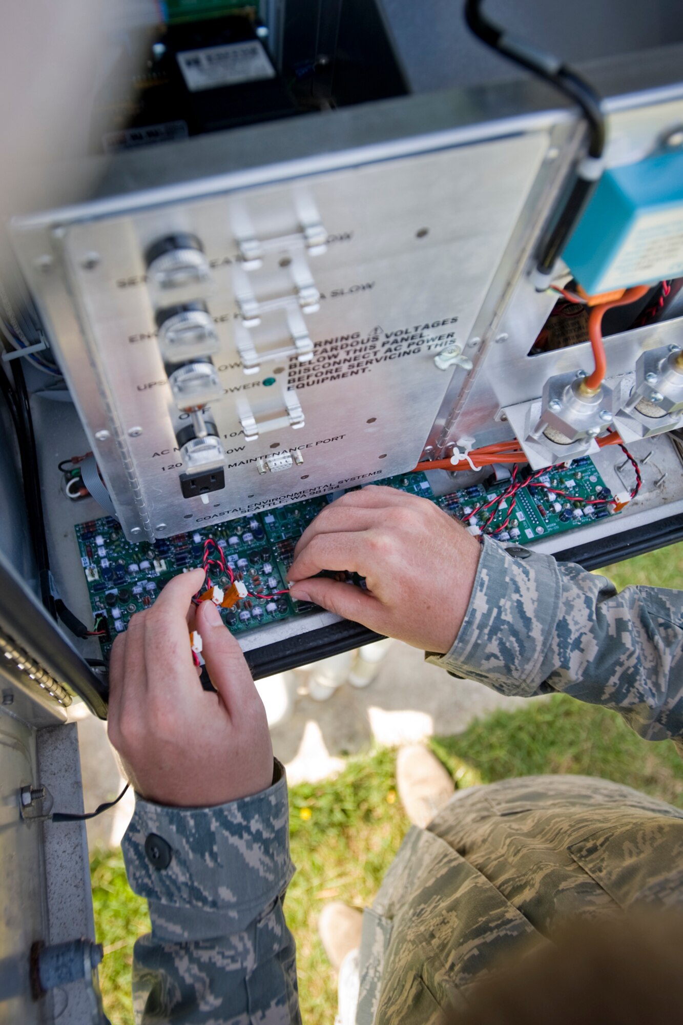 MISAWA AIR BASE, Japan -- Staff Sgt. James McGrath, 35th Communications Squadron airfield-systems maintenance technician, conducts maintenance on an automatic observation system Aug. 17 on the flightline. The station collects and reports data on weather including temperature, wind speed and direction, atmospheric pressure, precipitation in the form of snow, freezing rain, or regular rain, lightning and thunderstorms. (U.S. Air Force photo/Senior Airman Jamal D. Sutter)