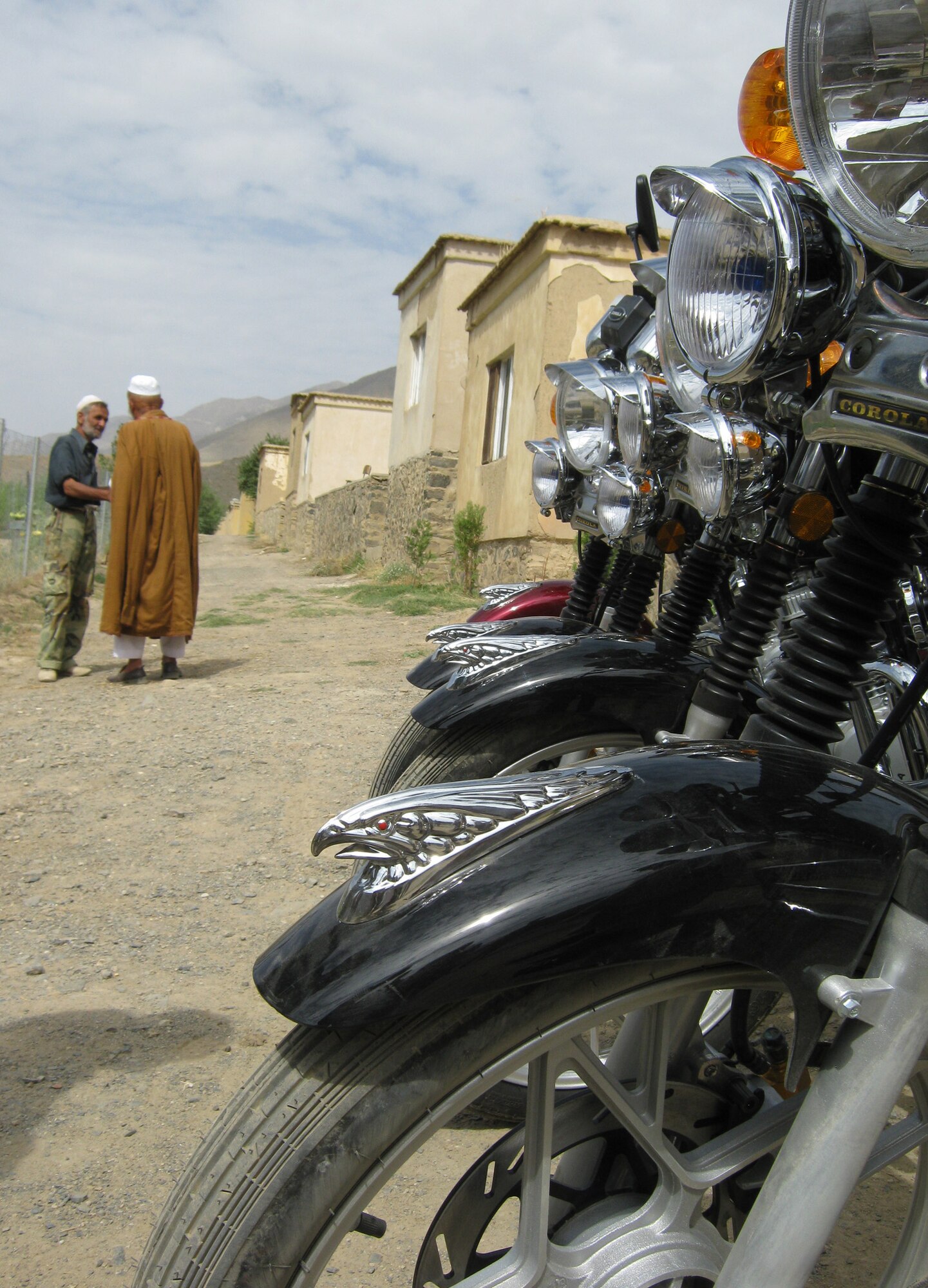On Aug. 17, members of the Kentucky National Guard Agribusiness Development Team with Provincial Reconstruction Team Panjshir delivered four brand-new Corola motorcycles to the Panjshir Province National Environmental Protection Agency director. Now, the director says the agency can enforce standards and do the government?s work. (Photo by U.S. Air Force 2nd Lt. Jason Smith, PRT Panjshir Public Affairs)
